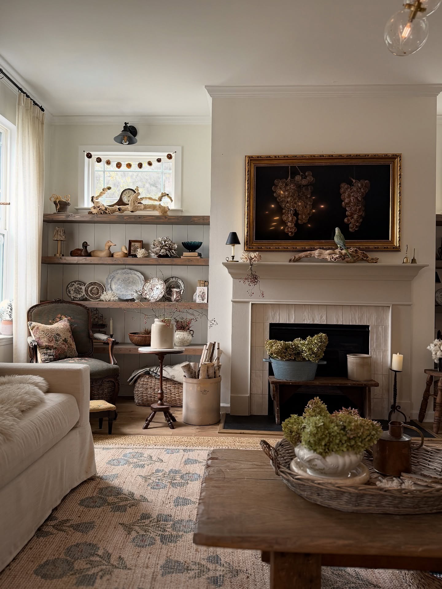 15. Use a Floral Rug to Connect Collected Furniture