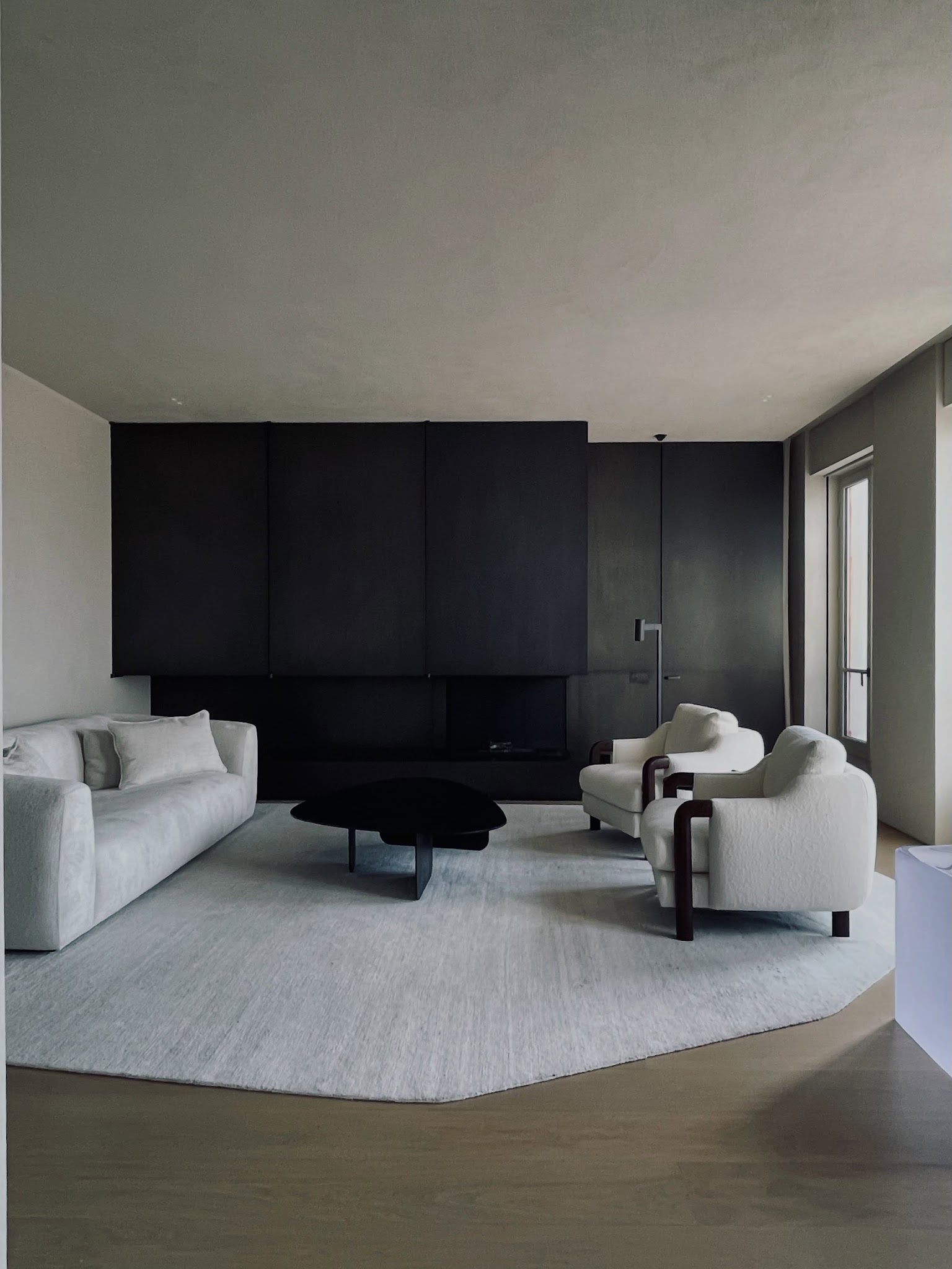 2. Anchor Pale Seating With One Dark Wall