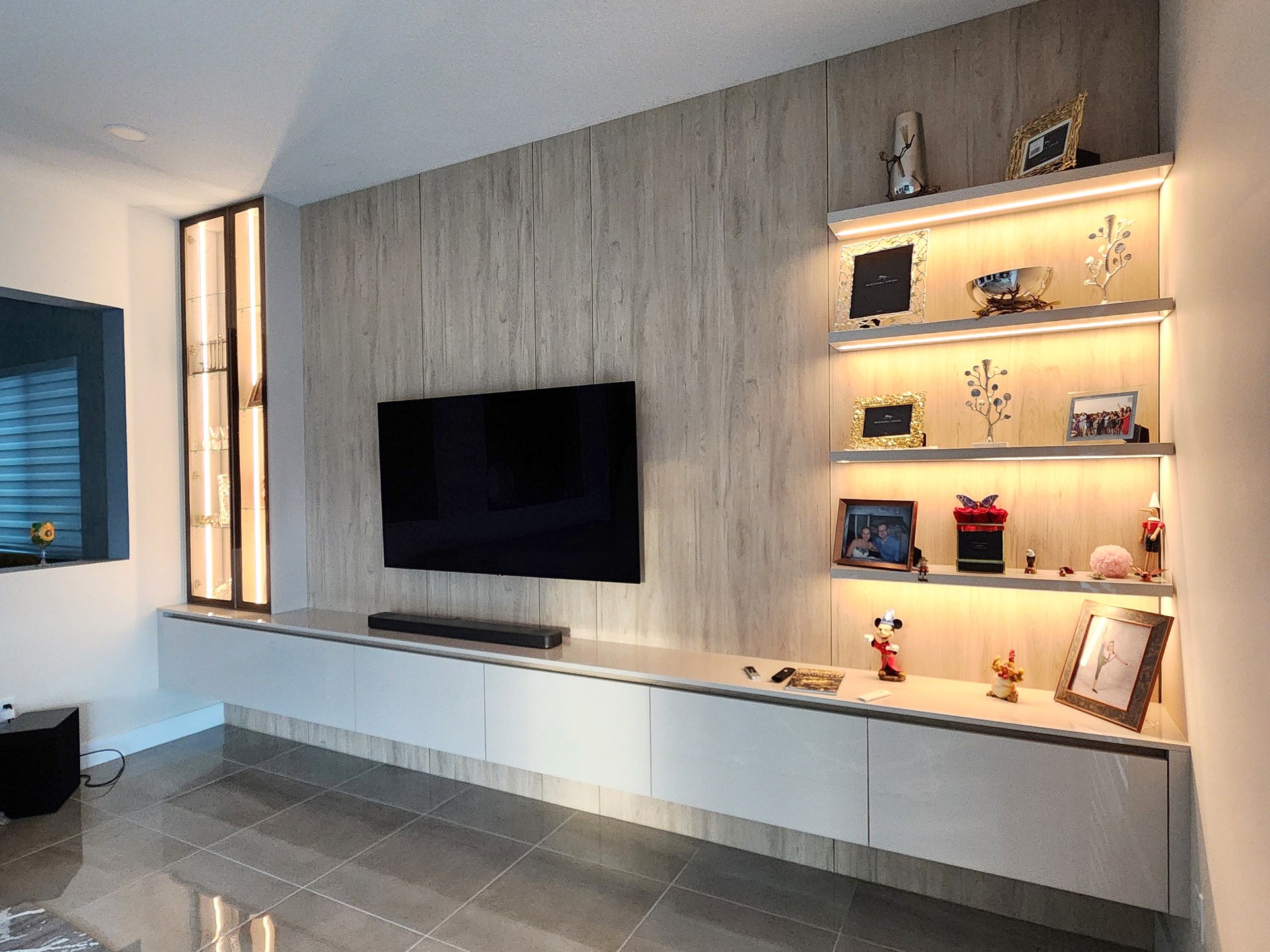 3. Balance Open Shelves With a Glass Display Tower