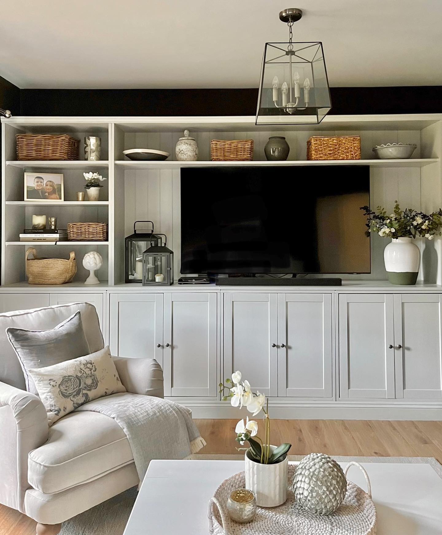 18. Organize a Media Unit With Repeated Baskets