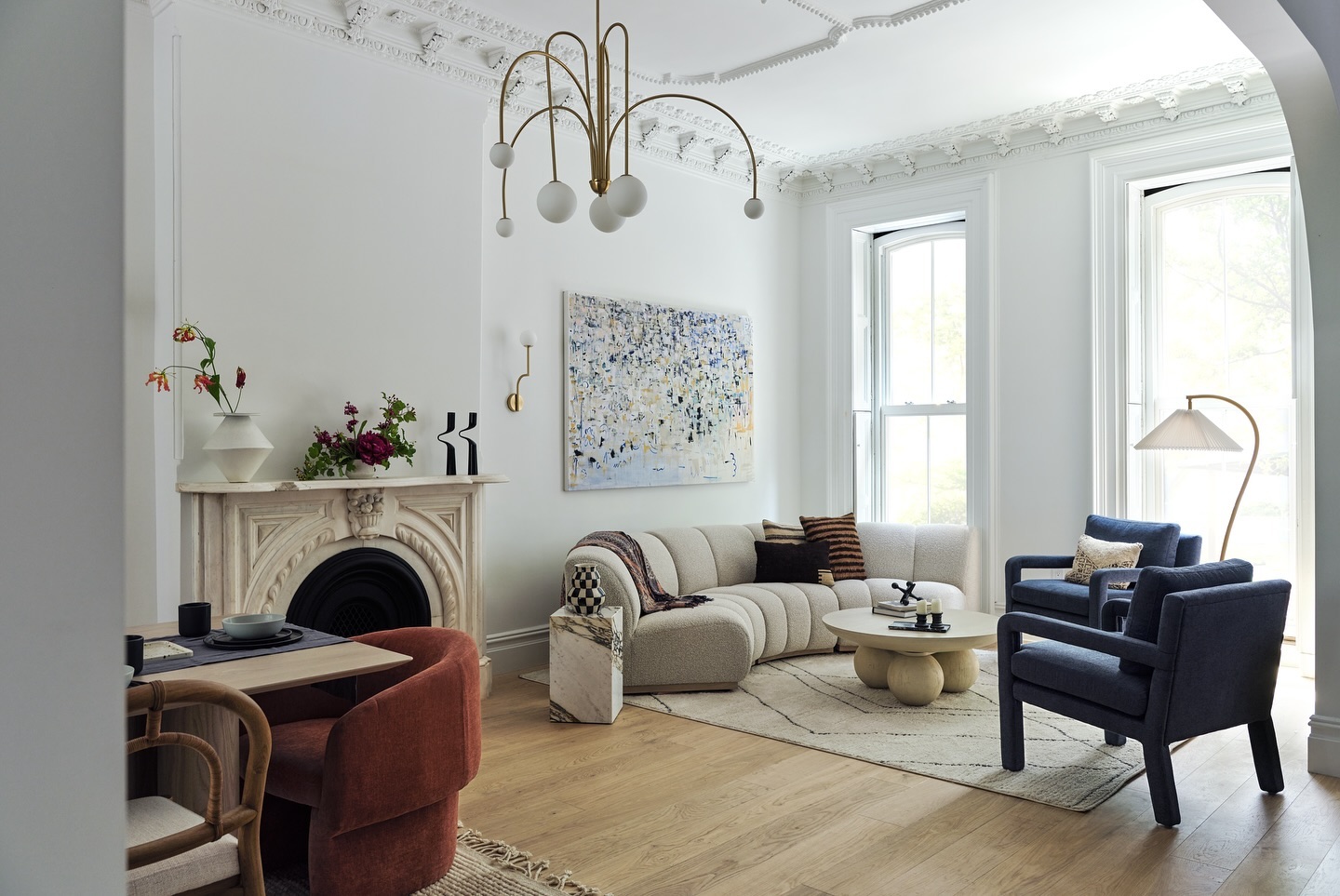 4. Set Sculptural Seating Beneath Detailed Plasterwork