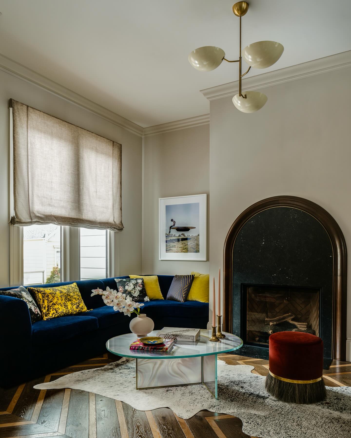 5. Echo an Arched Hearth With a Curved Sofa