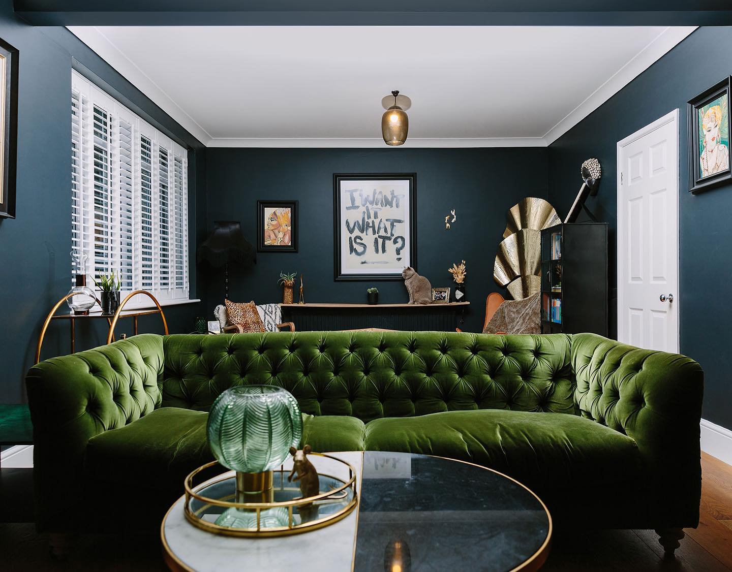 19. Repeat Gold Tones Against Deep Blue Walls