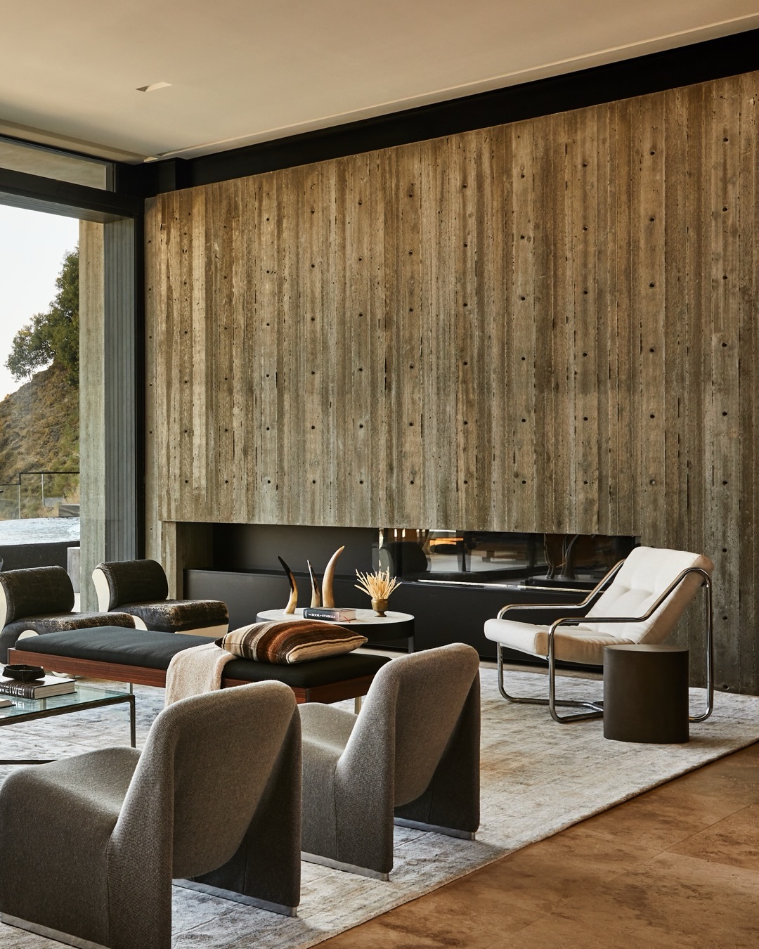6. Use a Textured Concrete Fireplace as the Backdrop