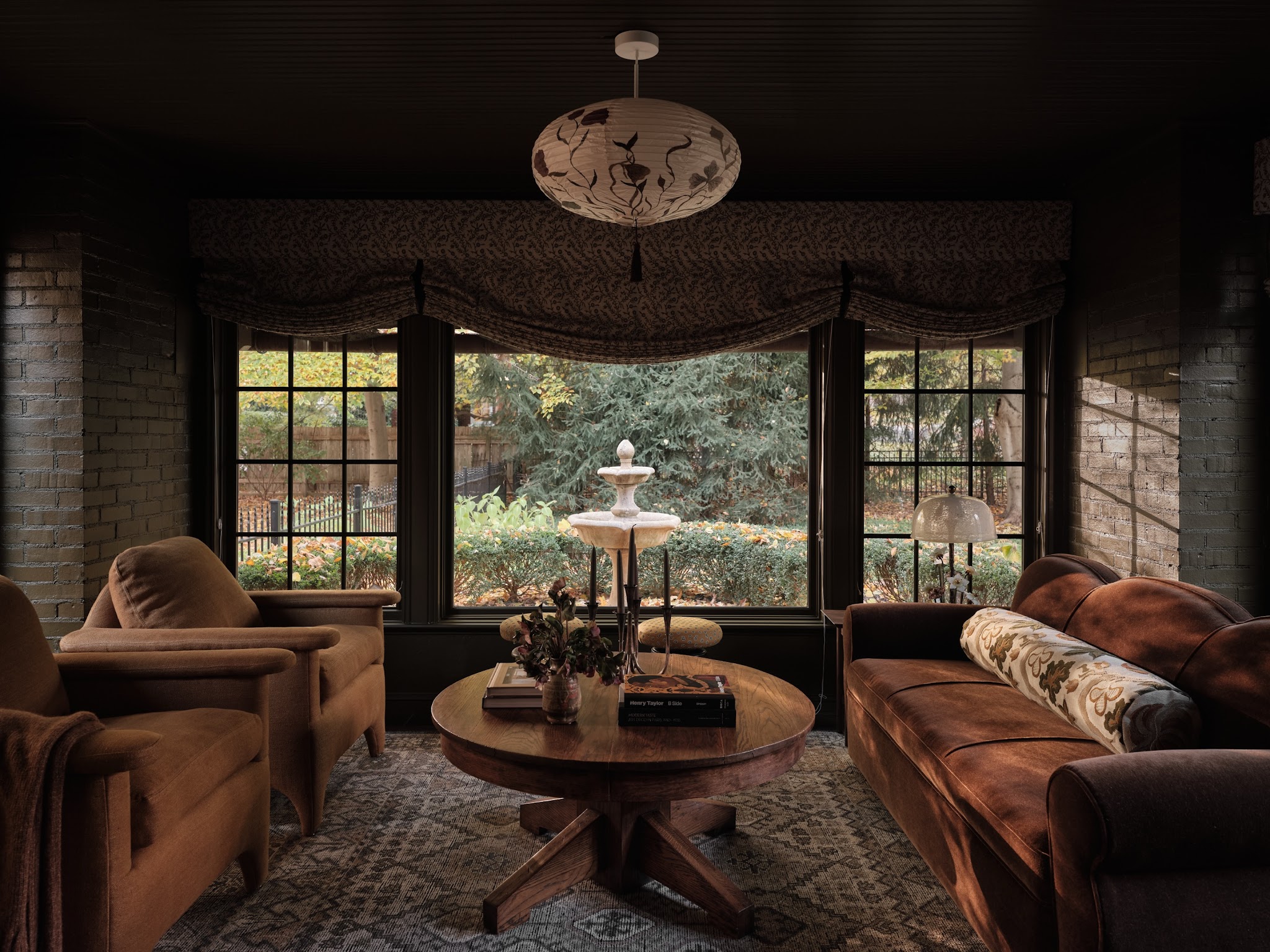 10. Soften a Dark Sunroom With Draped Shades