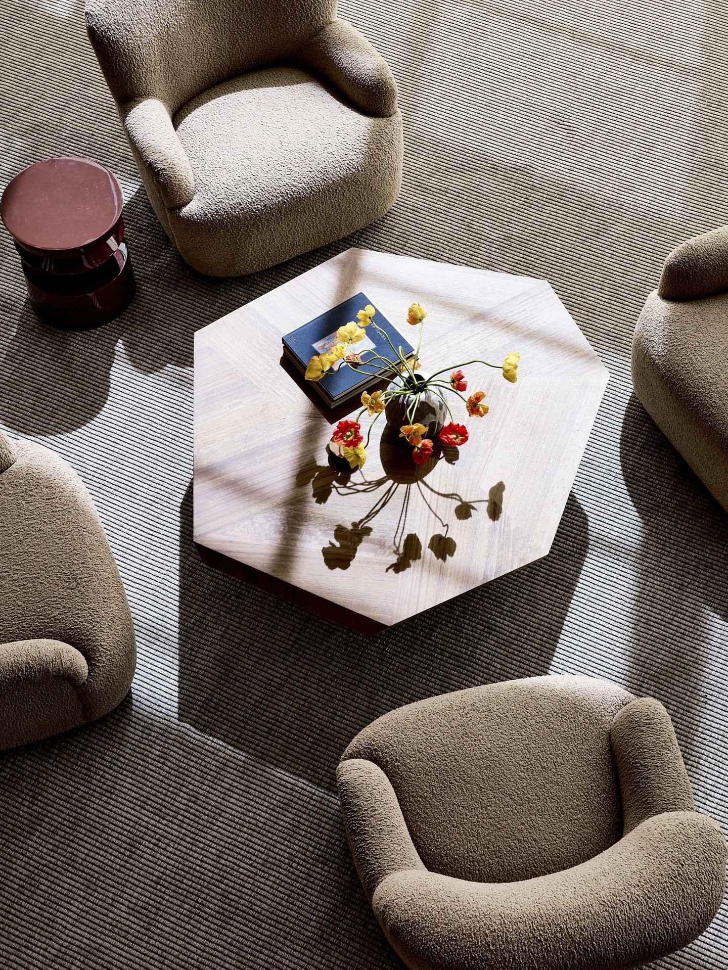 20. Gather Rounded Chairs Around a Geometric Coffee Table