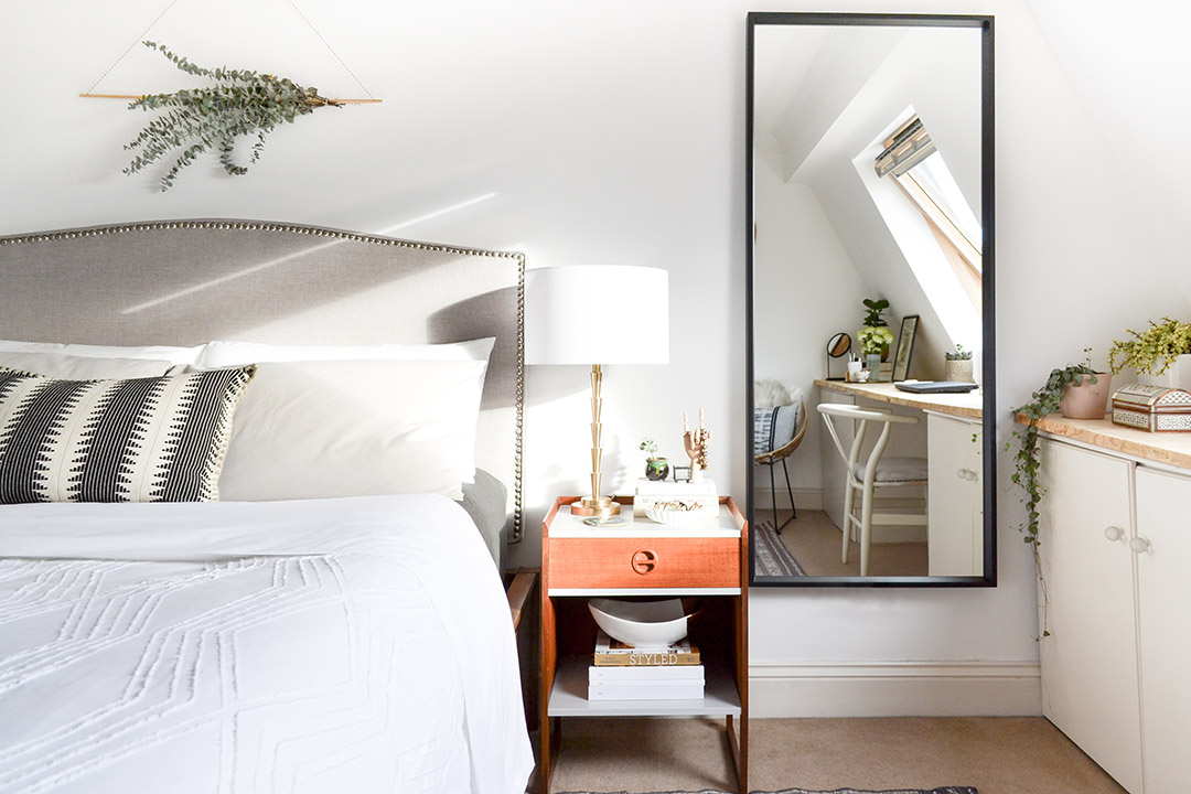 5. Mix a Soft Upholstered Bed With Warm Vintage Wood