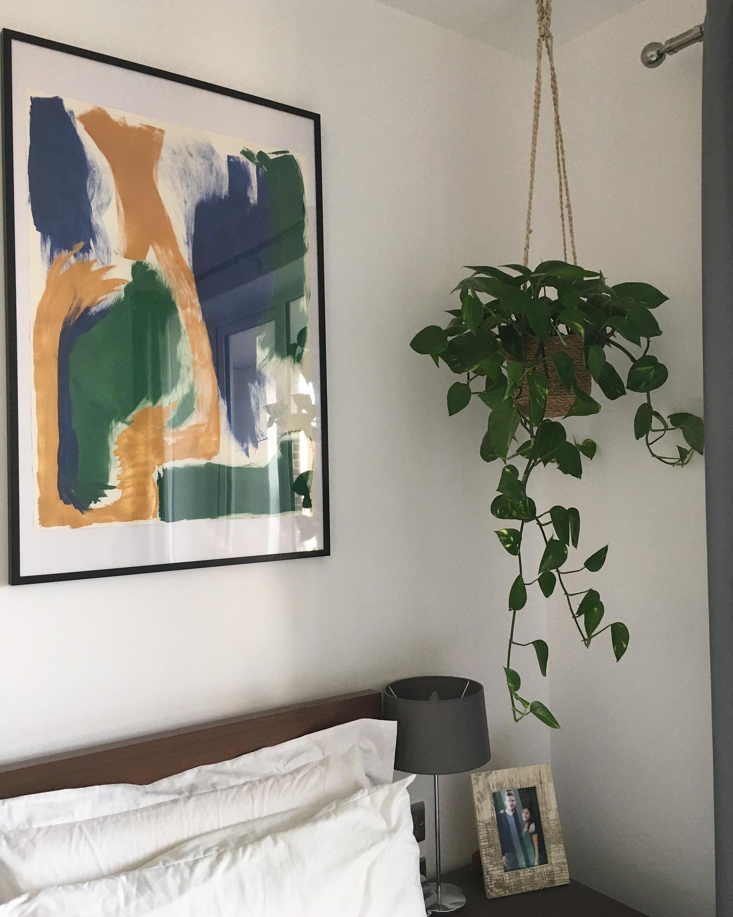 14. Soften a Simple Bedside Corner With Hanging Greenery
