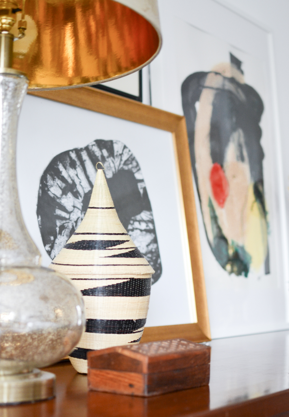 19. Balance a Woven Keepsake With Simple Framed Art