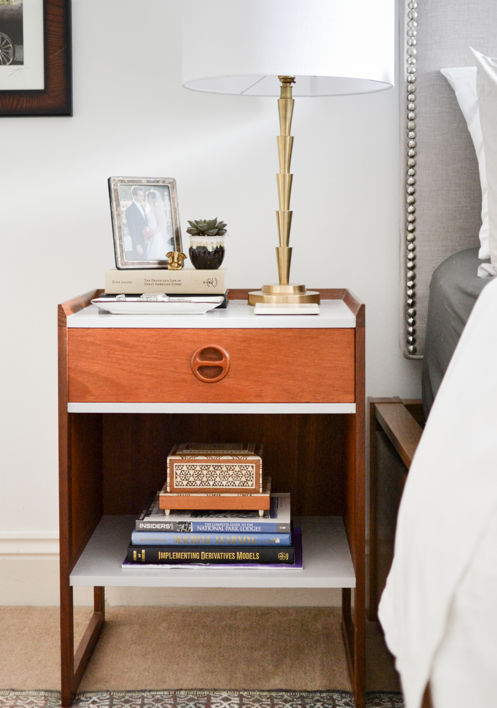 20. Refresh a Wooden Nightstand With Small Pale Accents