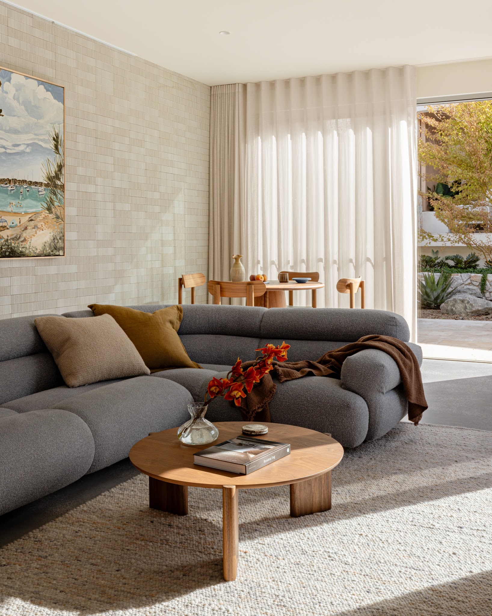 3. Soften a Gray Sofa With a Textured Pale Rug