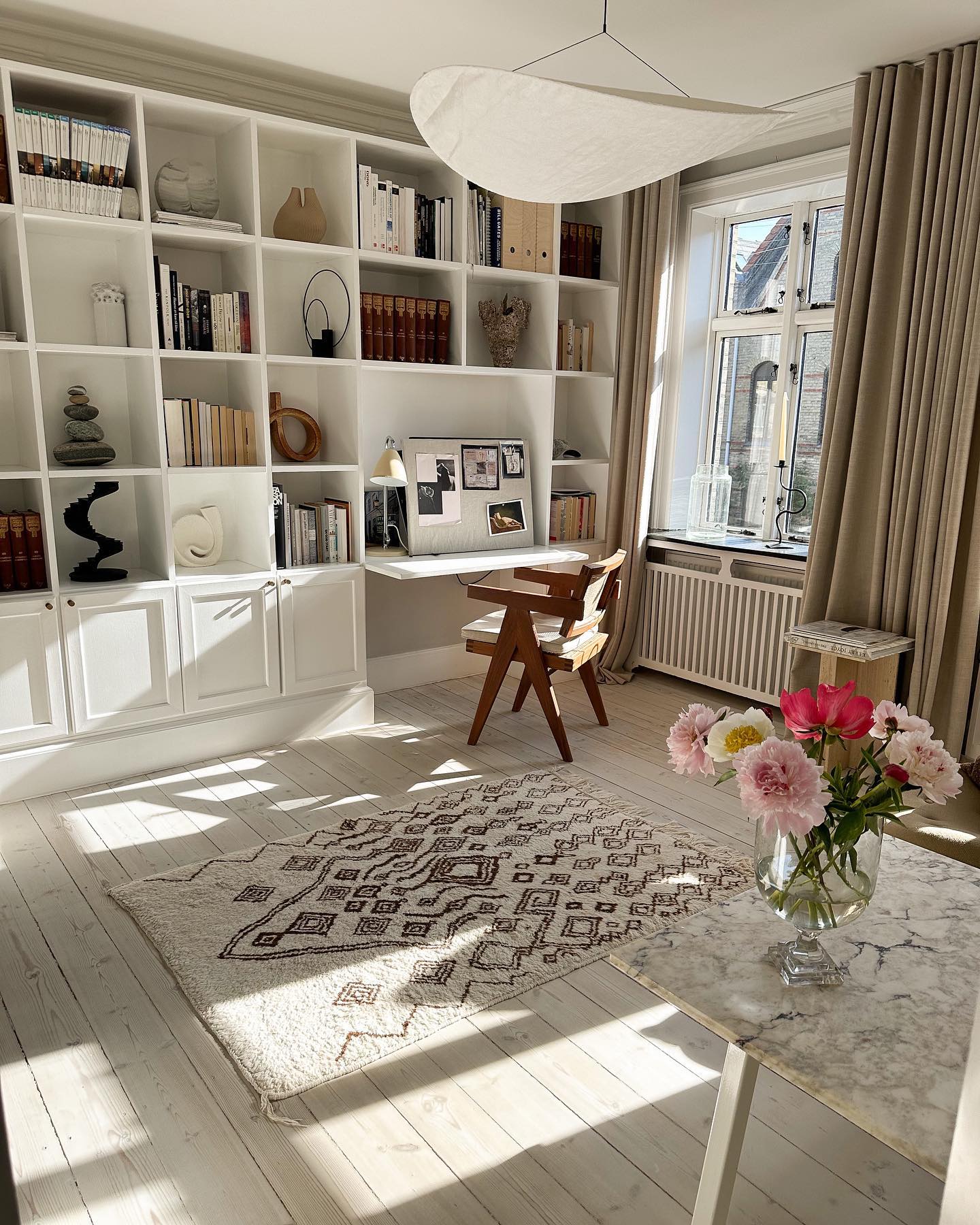 11. Reserve a Desk Opening in a Wall of Bookshelves