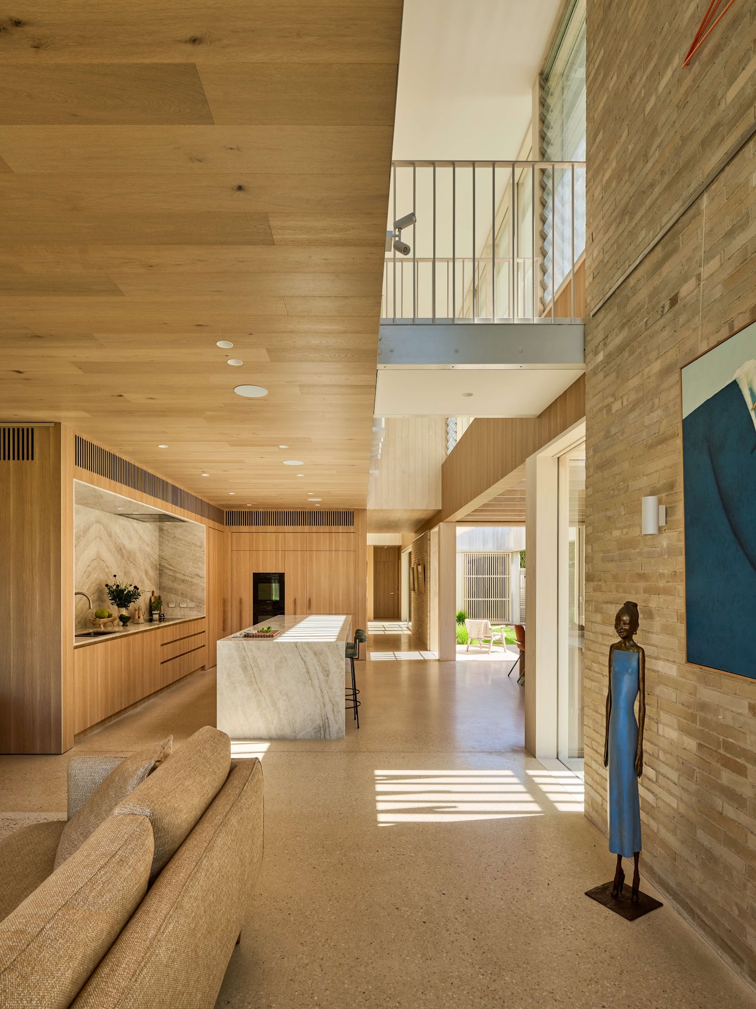 6. Carry Warm Finishes Through the Whole Space