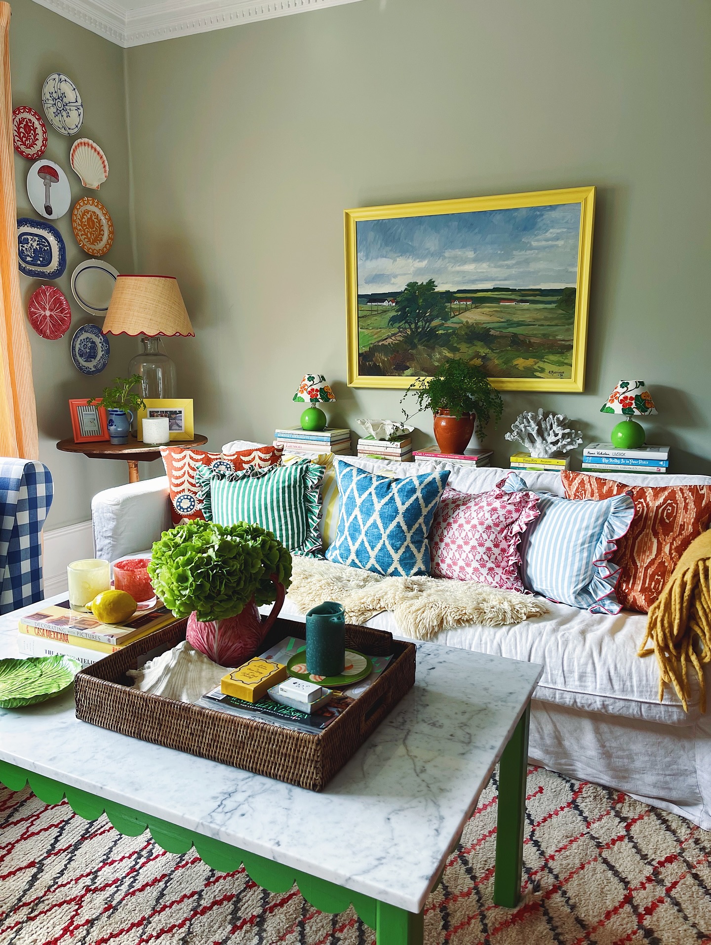 7. Use Sage Walls Behind a Collected Sofa