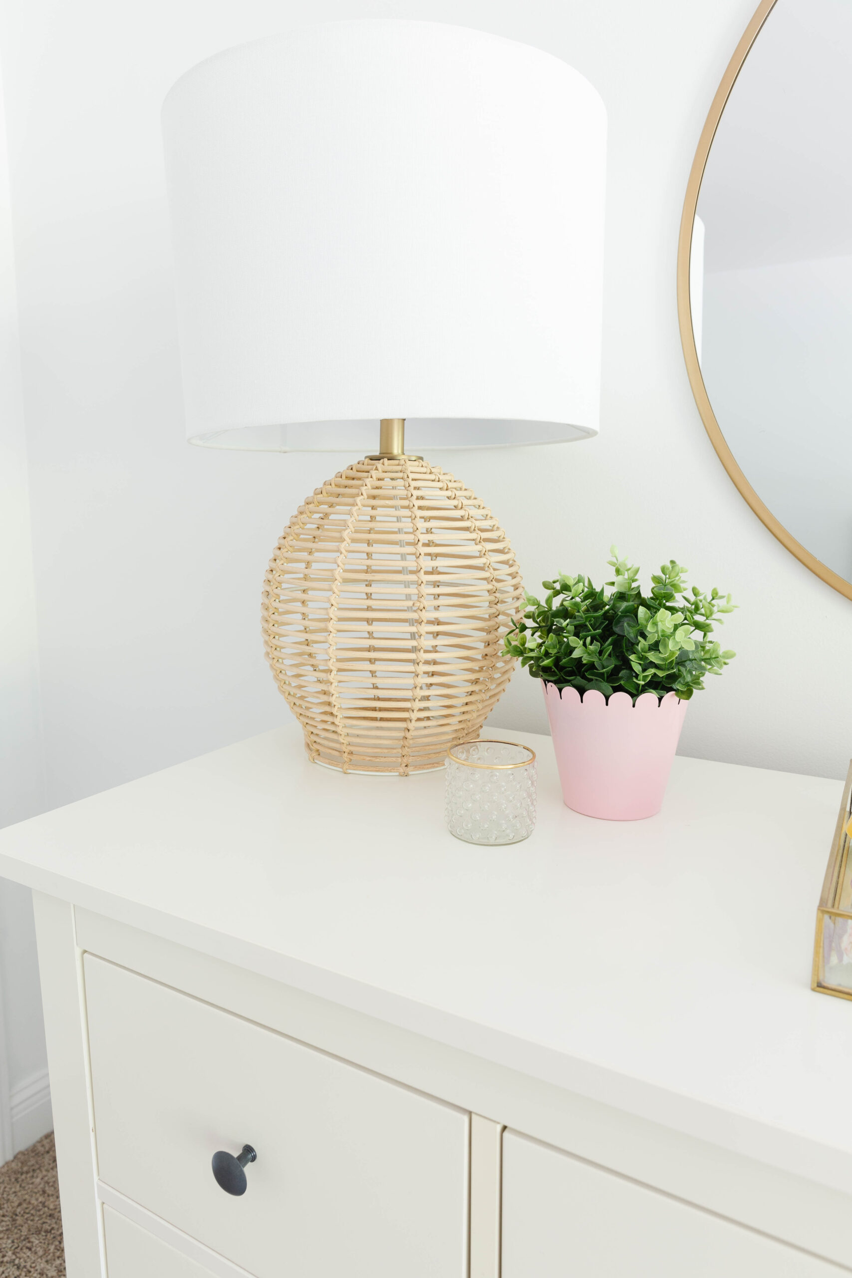 11. Style a Rattan Lamp Beside a Pink Planter