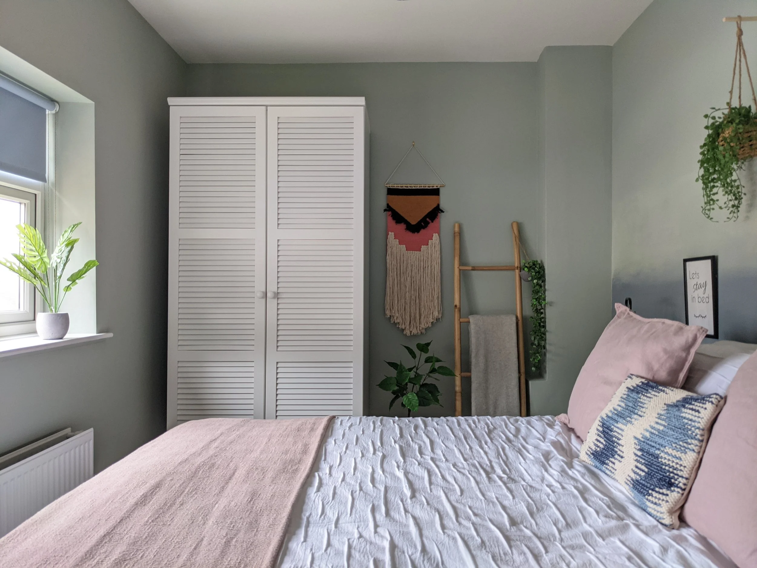 13. Use White Louvered Storage Beside Pink Linens