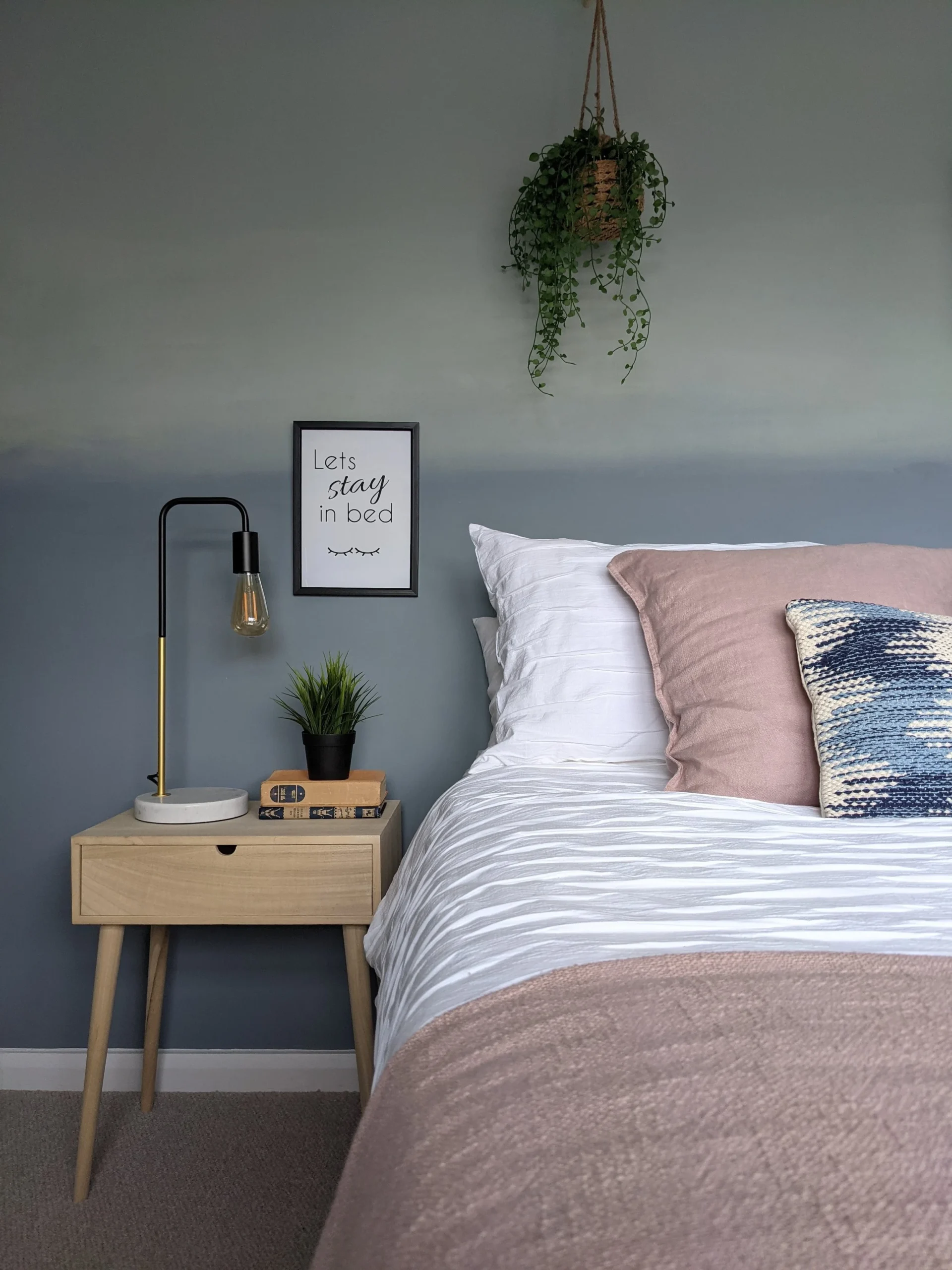 18. Warm Sea Blue Walls With Pink Linen and Light Wood