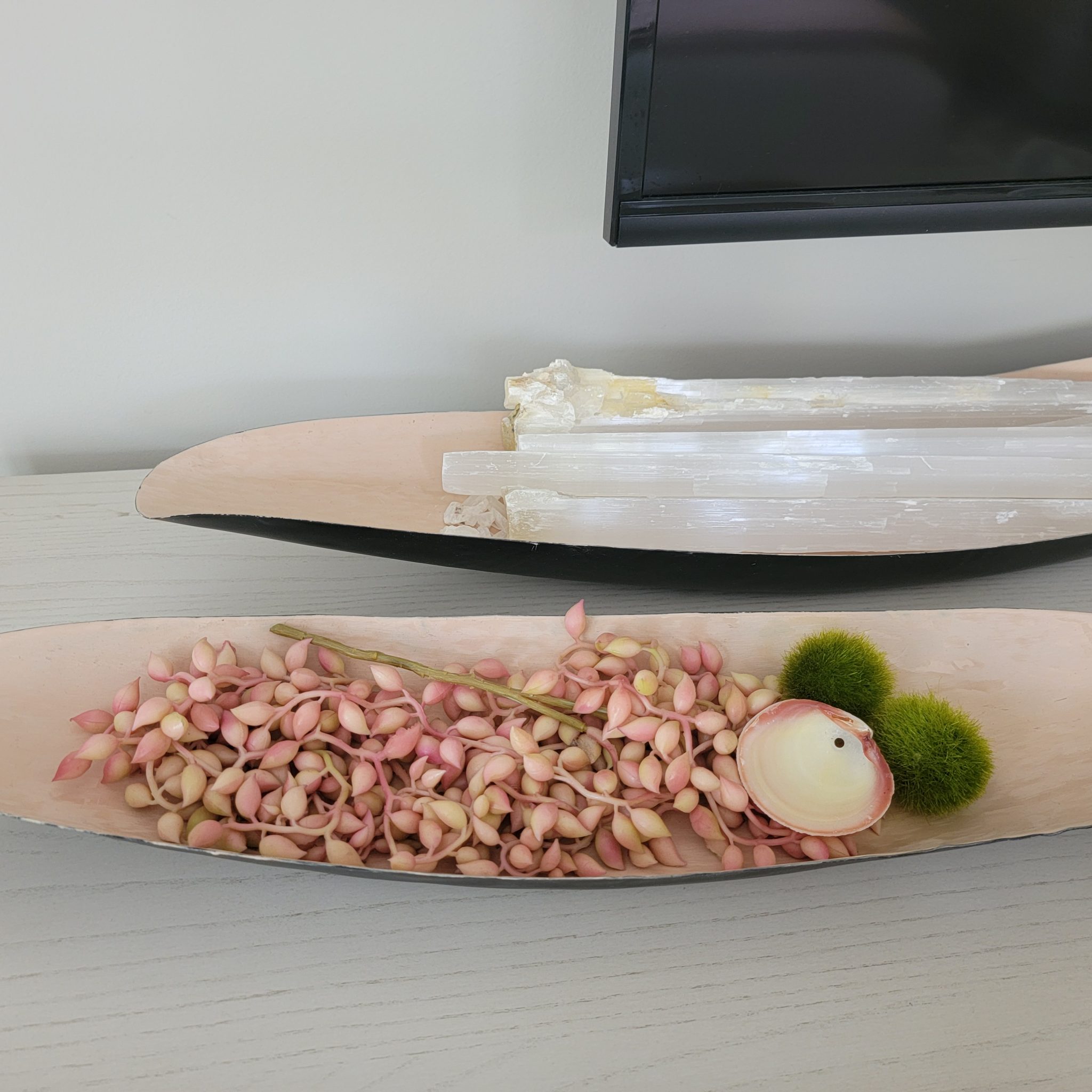 20. Finish a Dresser With a Pink Shell and Sculptural Trays