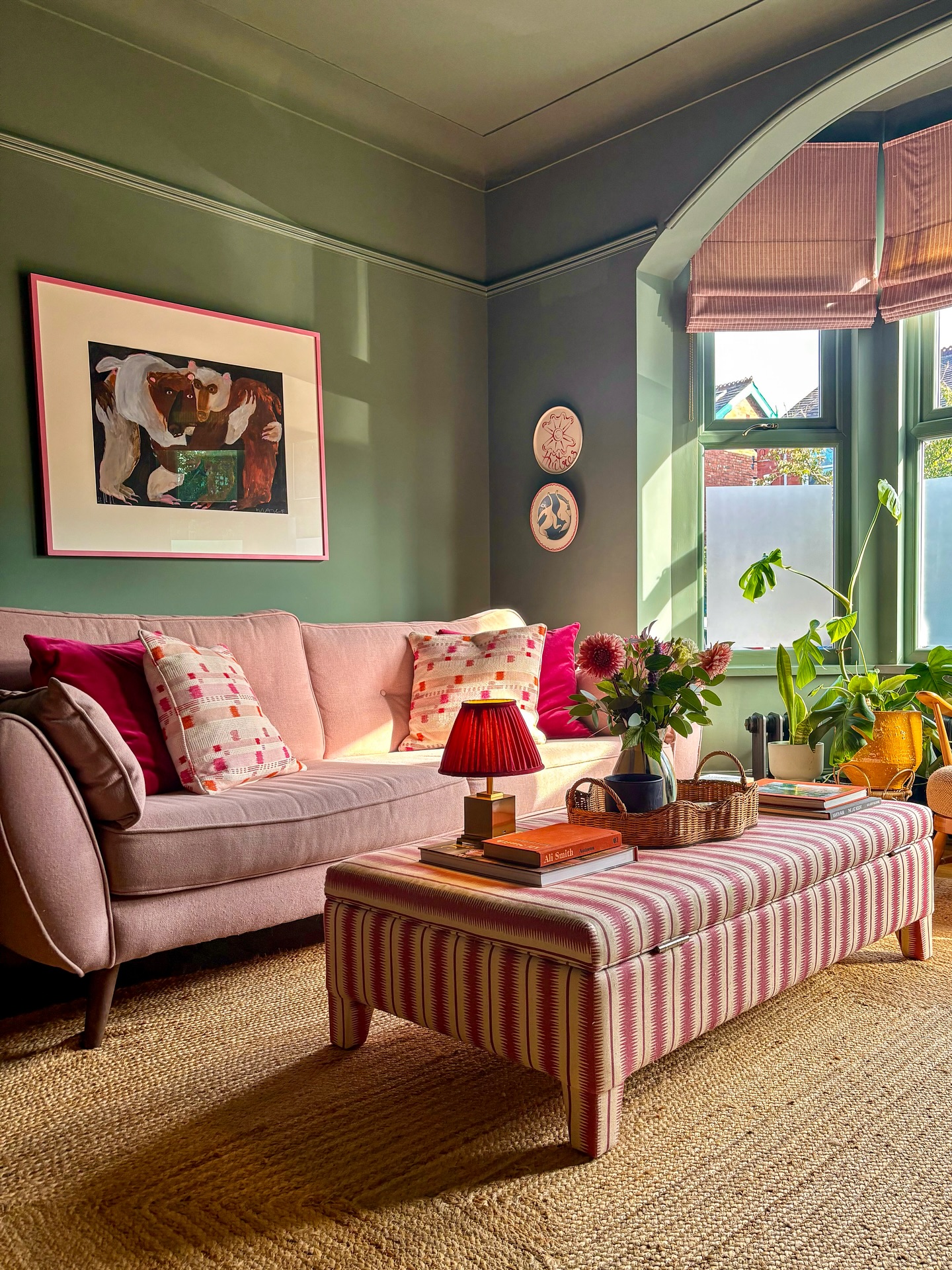 3. Set a Blush Sofa Against Green Paneling