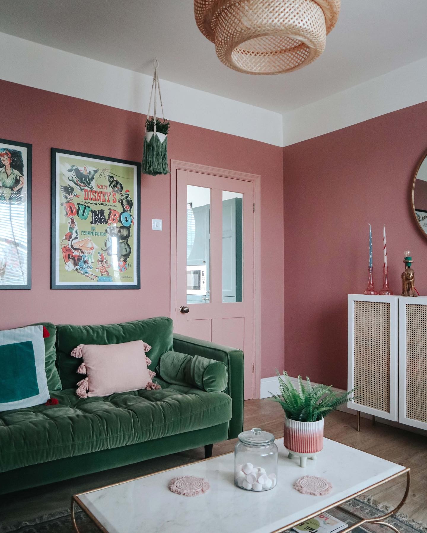 5. Balance Dusty Rose with a Deep Green Sofa