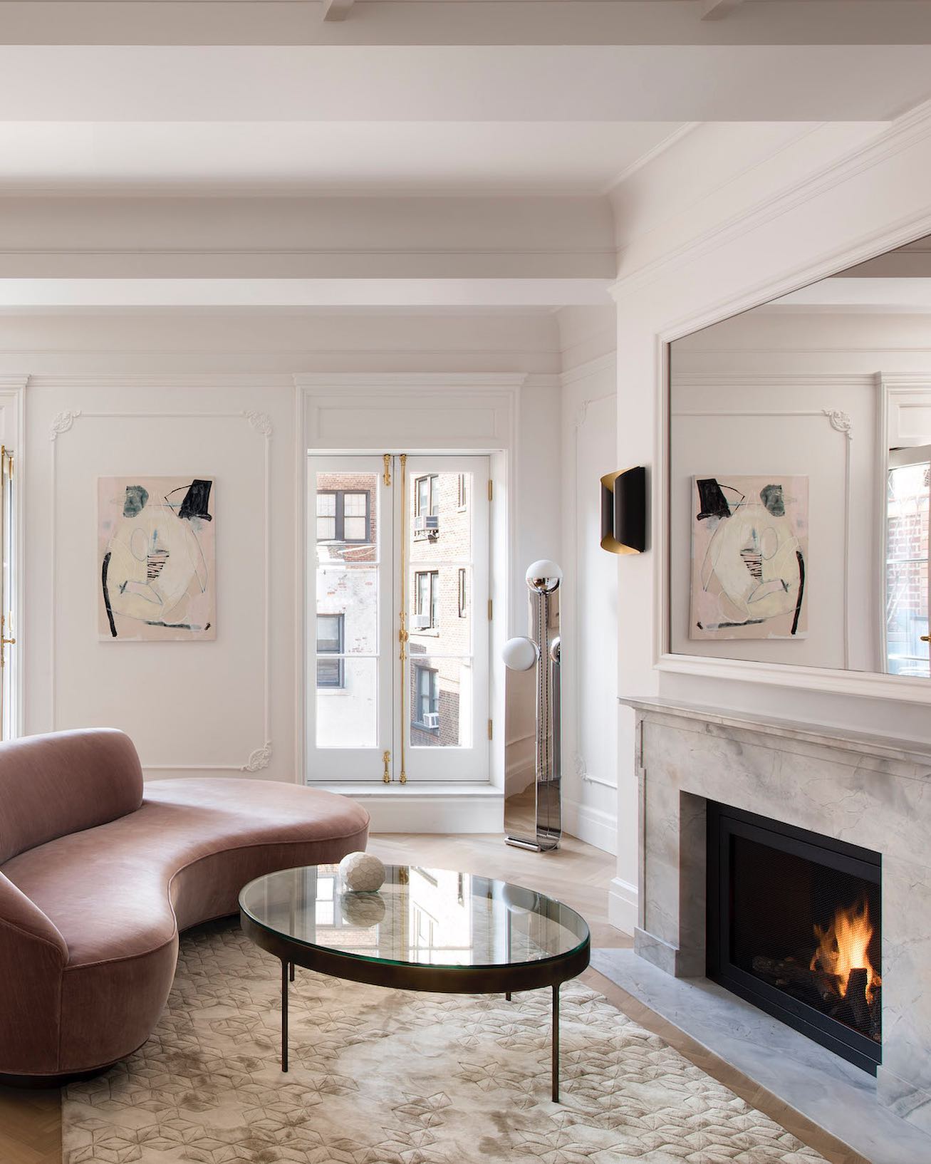 14. Soften a Formal Room with a Curved Pink Sofa