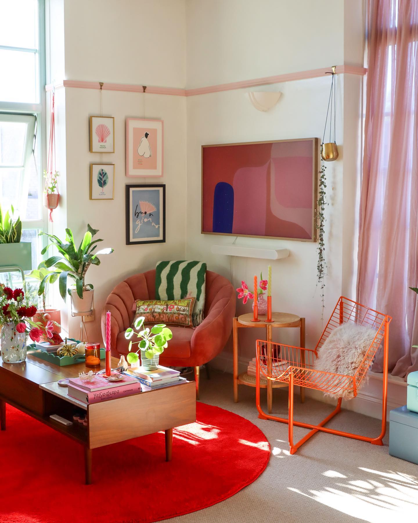 16. Pair Pink Curtains with Orange Seating