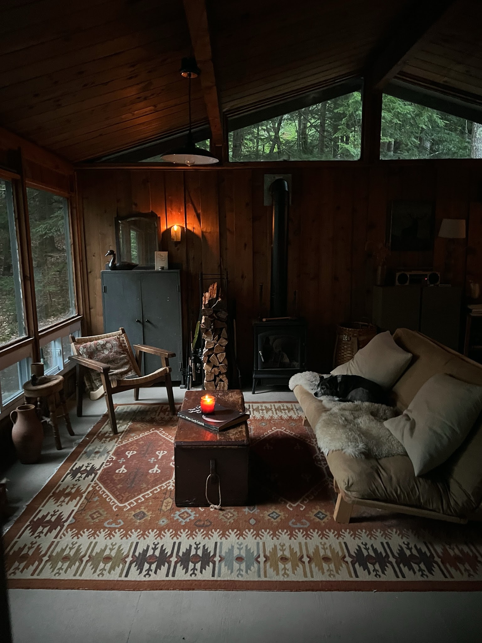 11. Ground a Dark Cabin with a Faded Red Rug