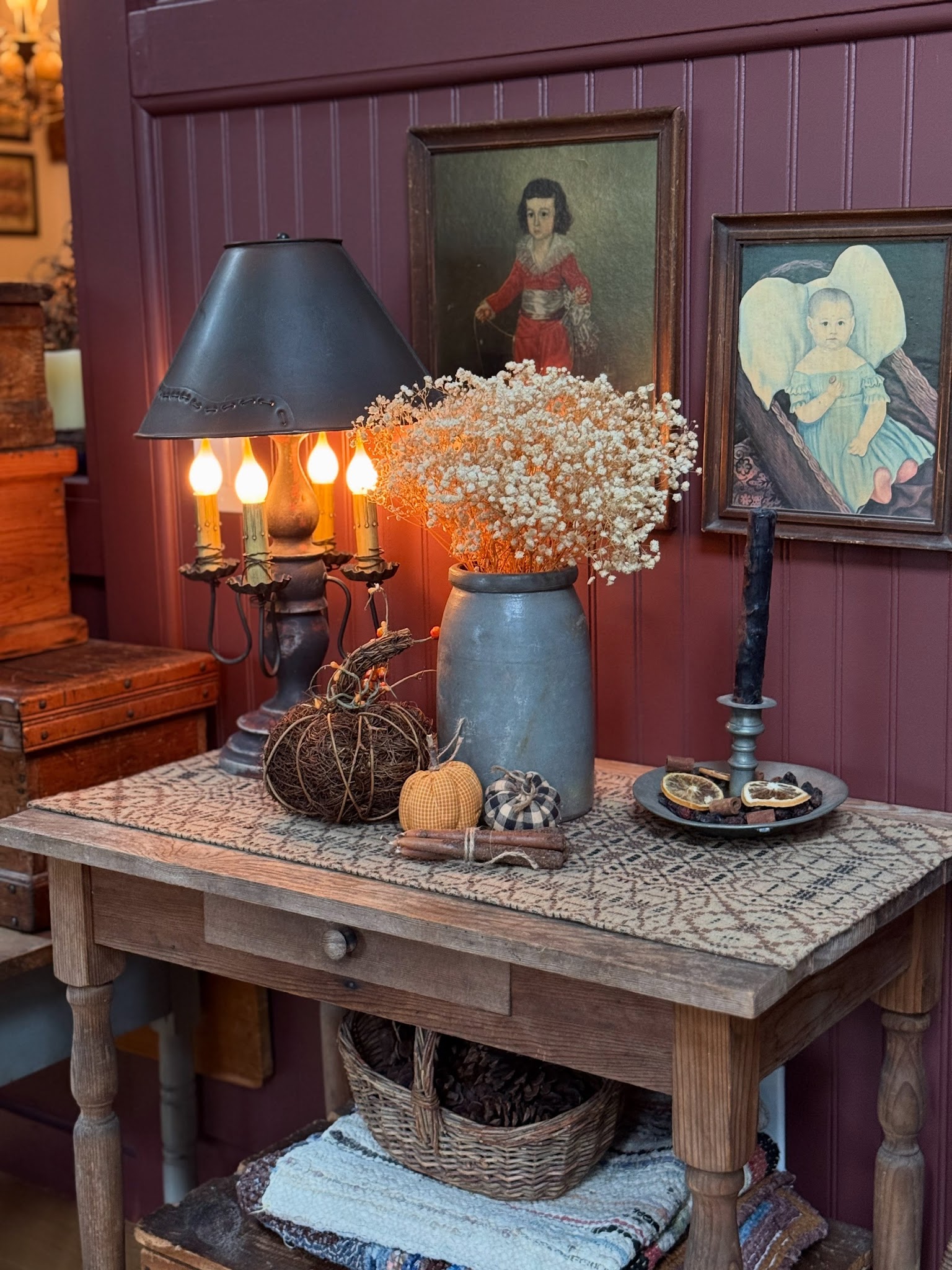 18. Layer a Weathered Table against Burgundy Paneling