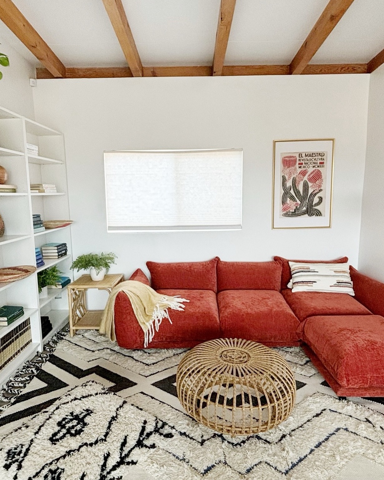 4. Warm a White Room with a Rust Sectional