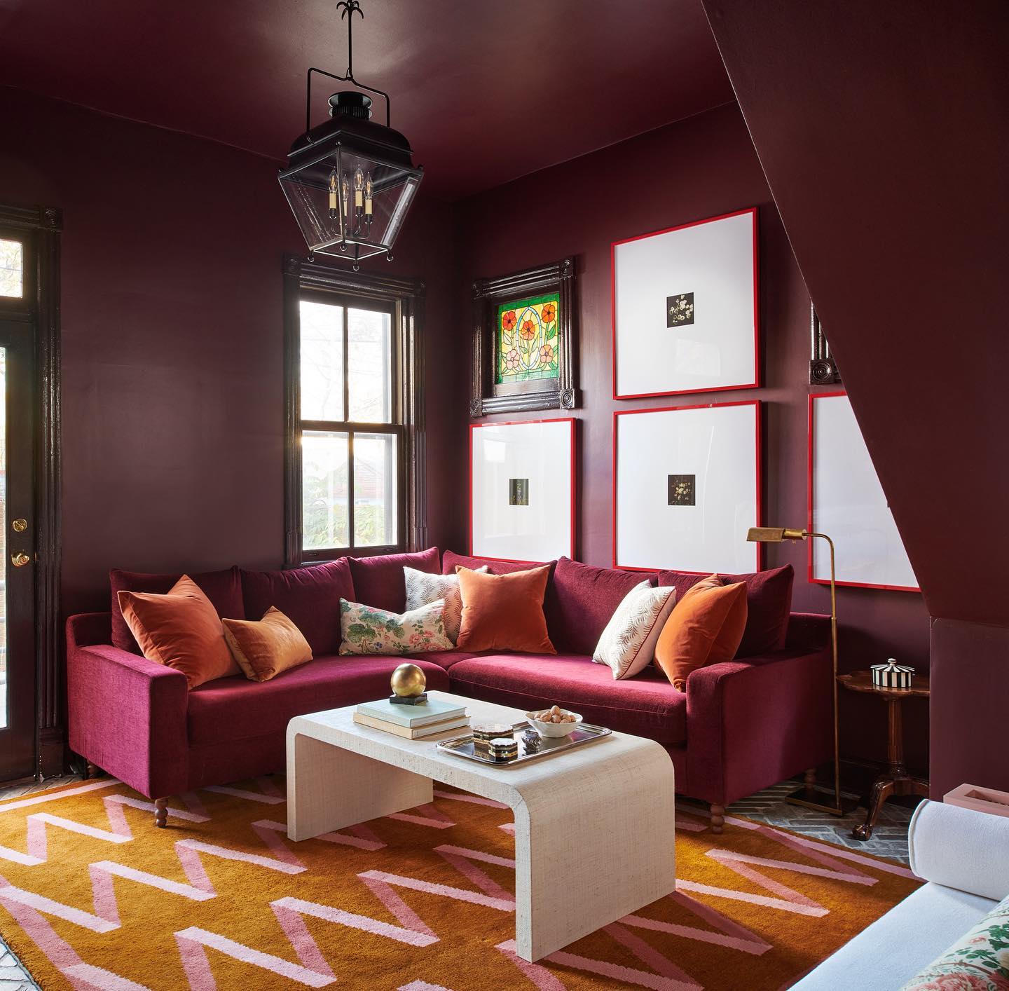 9. Outline Art in Red Against Burgundy Walls