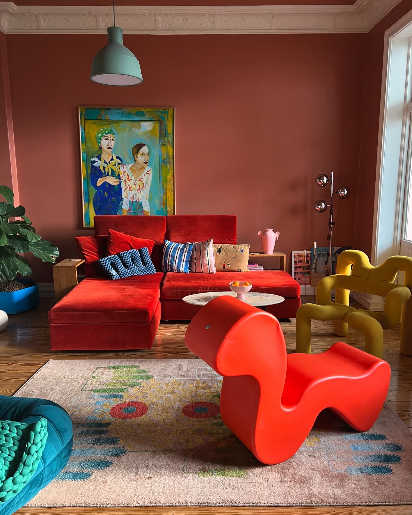 12. Mix a Red Sectional with Sculptural Chairs