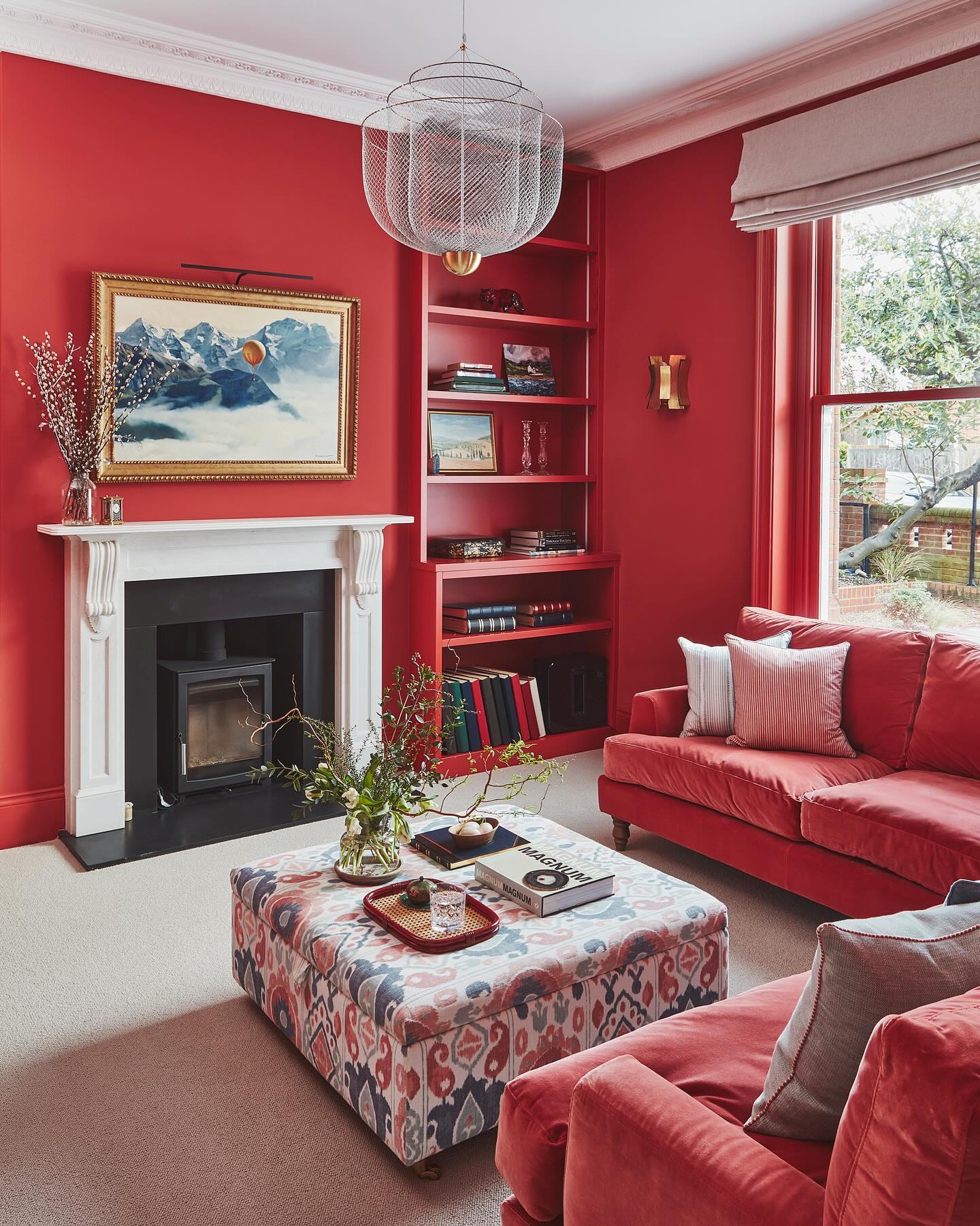 14. Let a White Fireplace Stand Out in Red