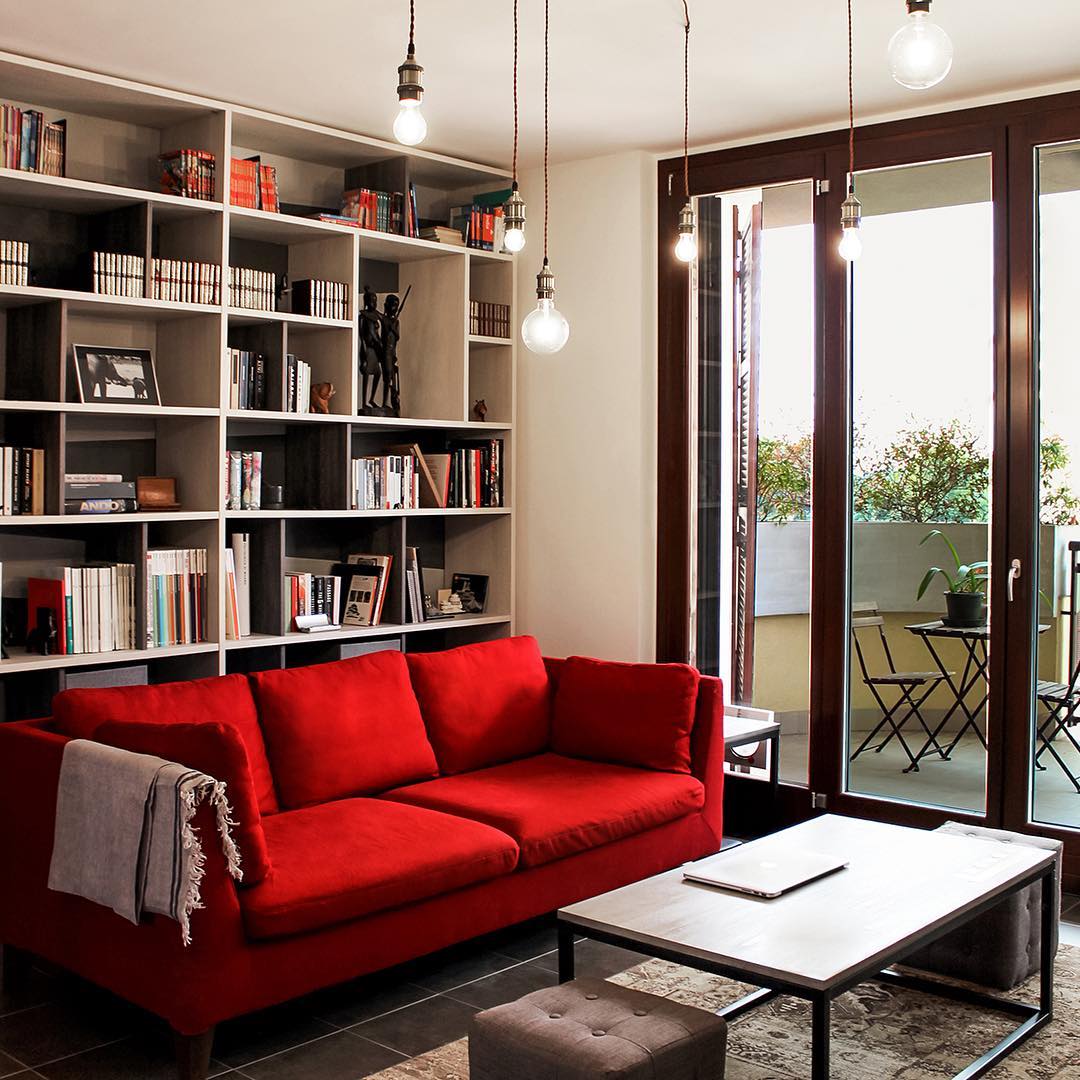 18. Place a Red Sofa Against a Full Bookcase