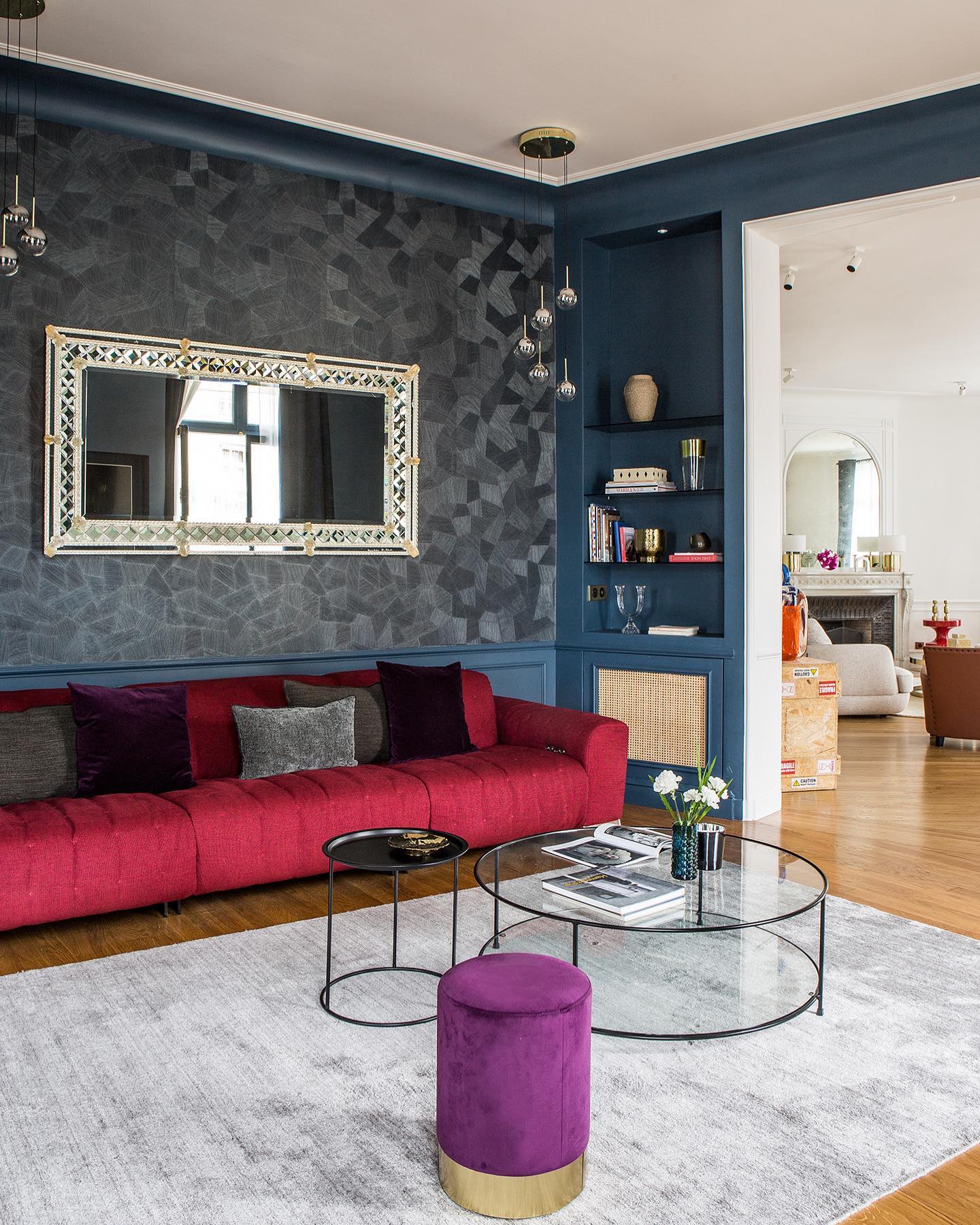 20. Contrast a Red Sofa with Deep Blue Walls