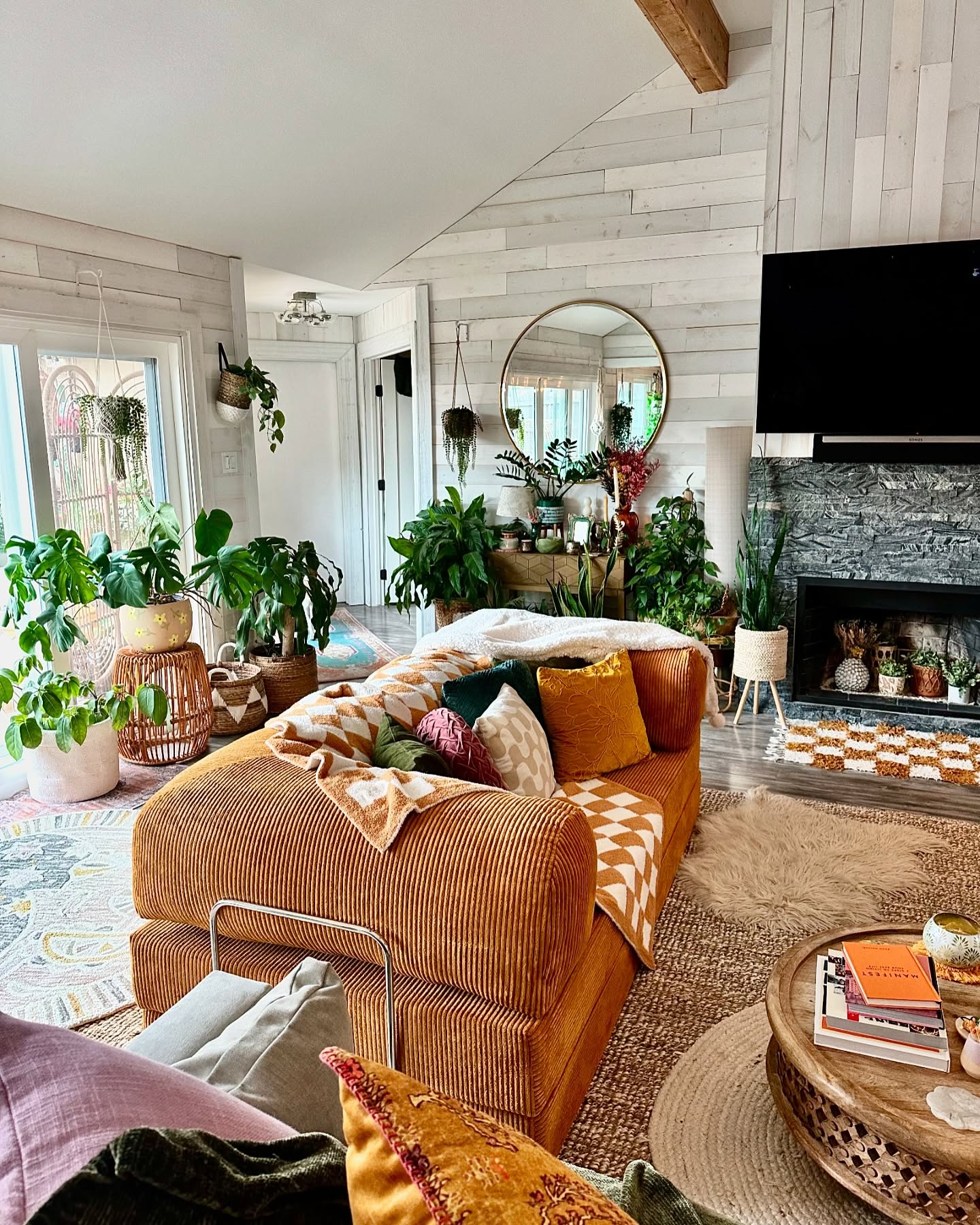 3. Layer a Plush Sofa Against Pale Plank Walls