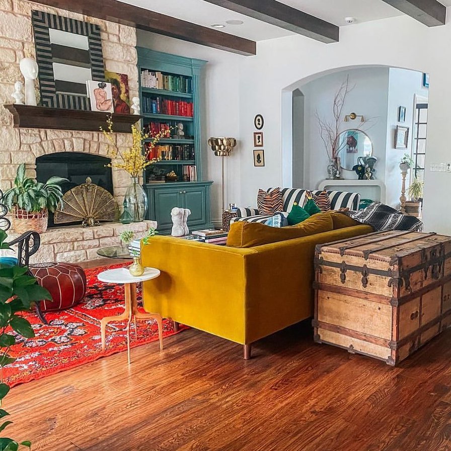 8. Use a Weathered Trunk Beside a Colorful Sofa