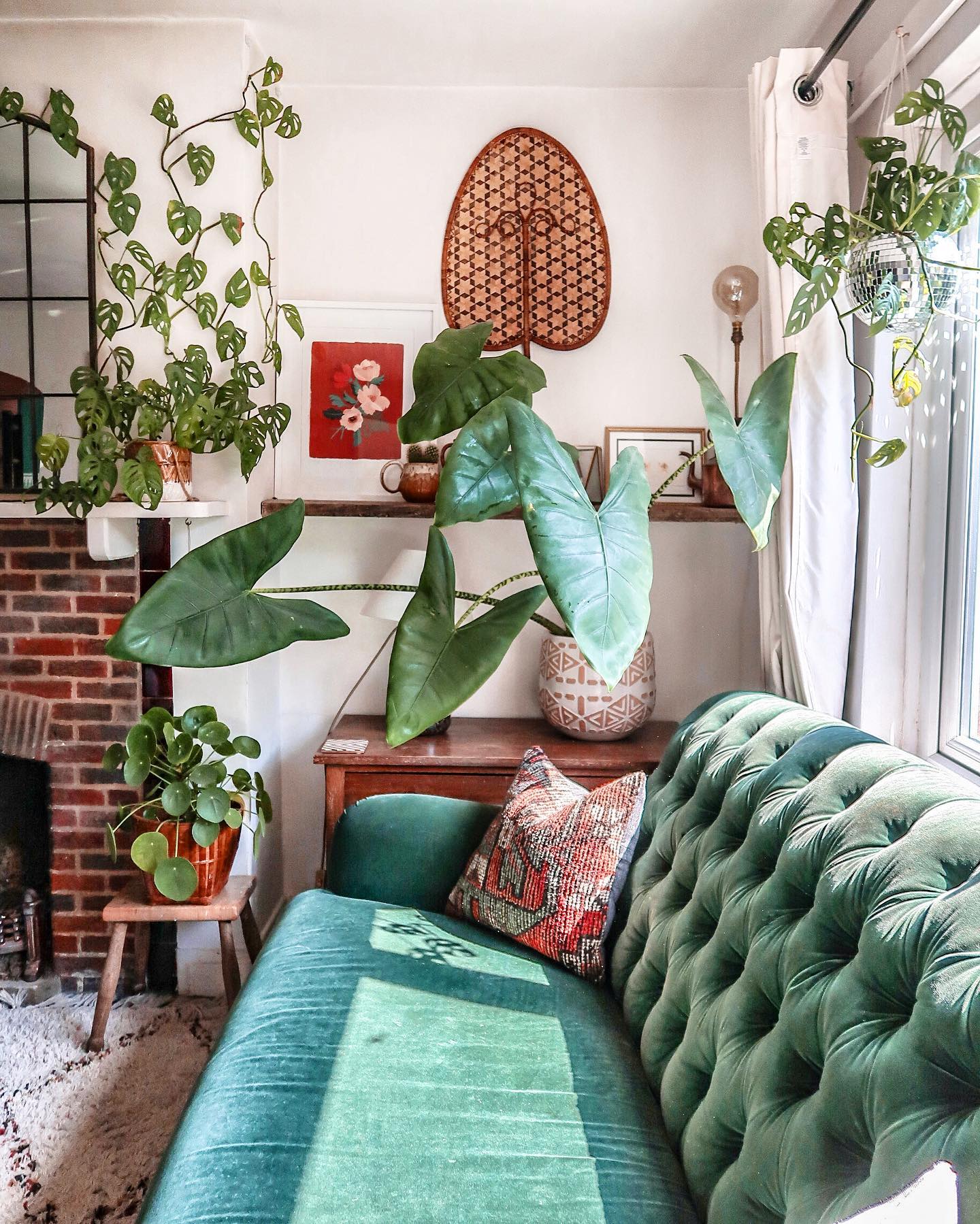 15. Repeat Leafy Green Around a Brick Fireplace