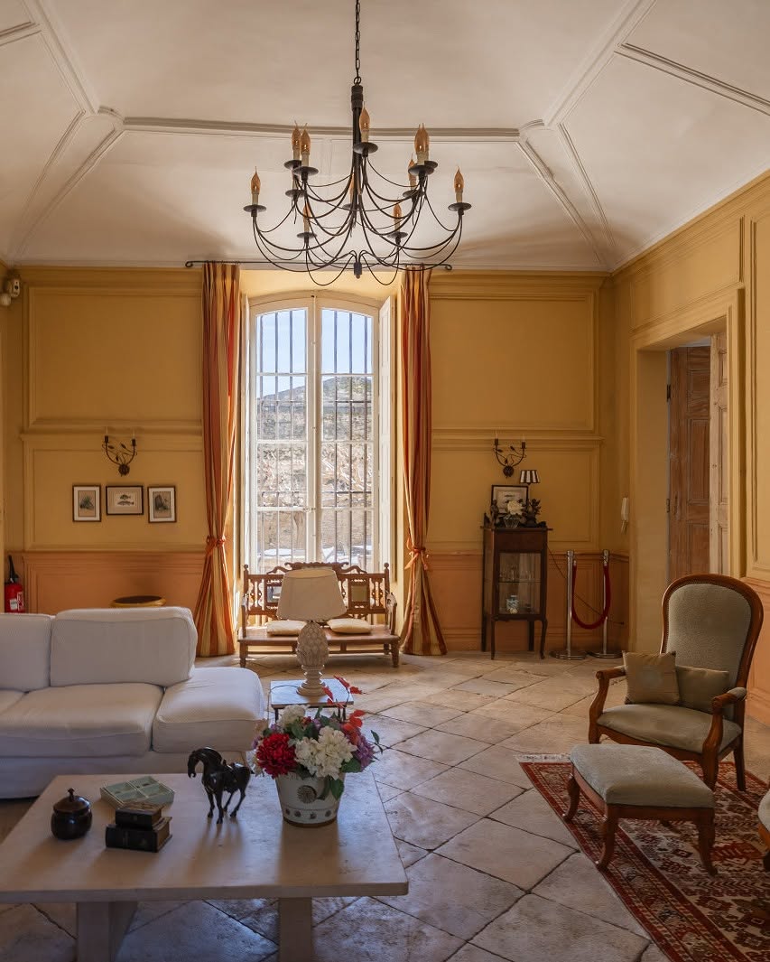 9. Warm Pale Stone Floors with Ochre Walls