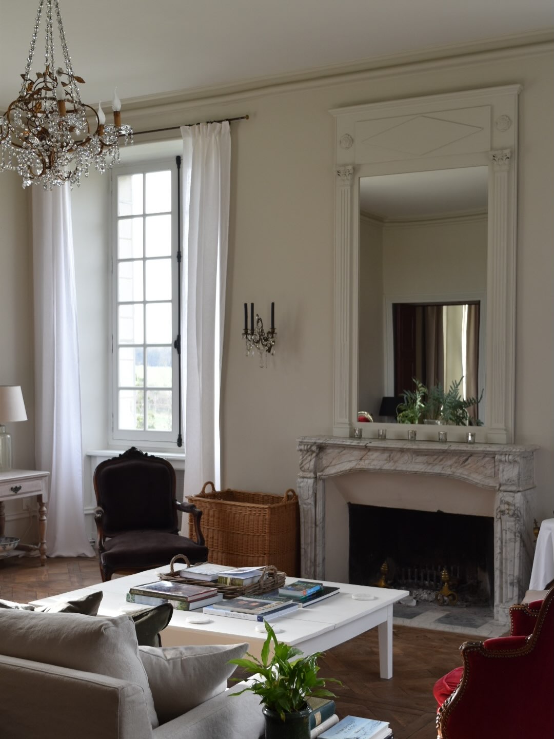 11. Balance an Ornate Mirror with Simple Seating