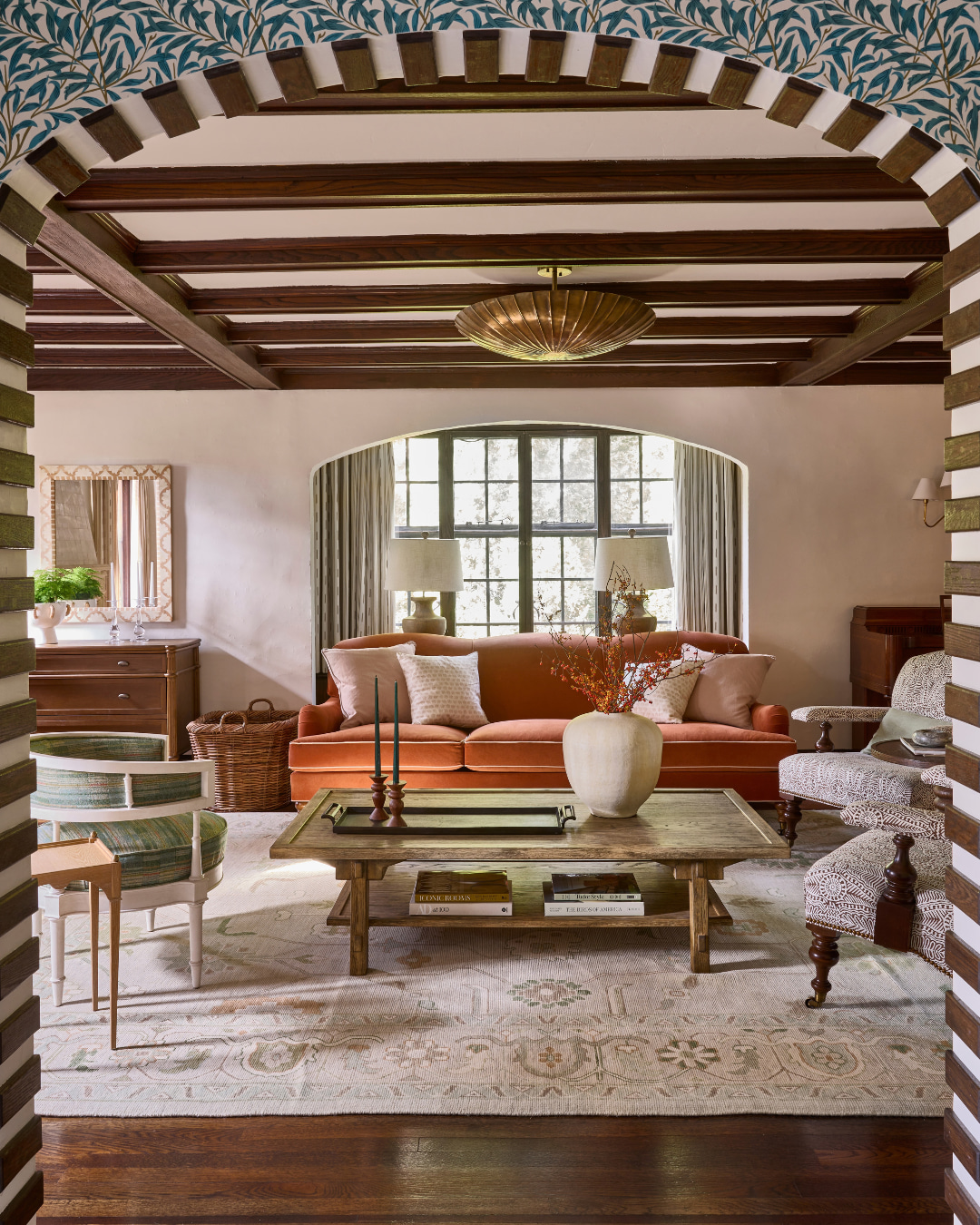 3. Warm Dark Beams With an Earthy Orange Sofa