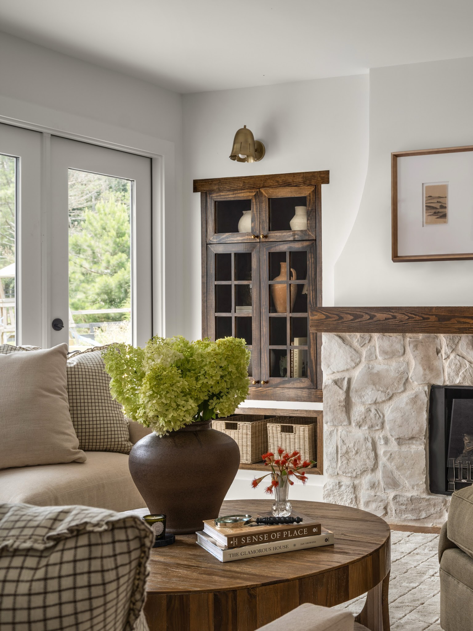 5. Pair Pale Stone With a Wood Display Cabinet