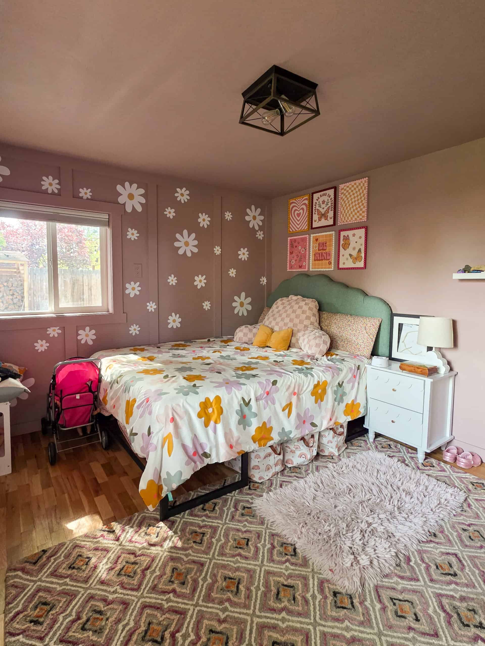 5. Hang a Cheerful Frame Grid Above a Sage Headboard