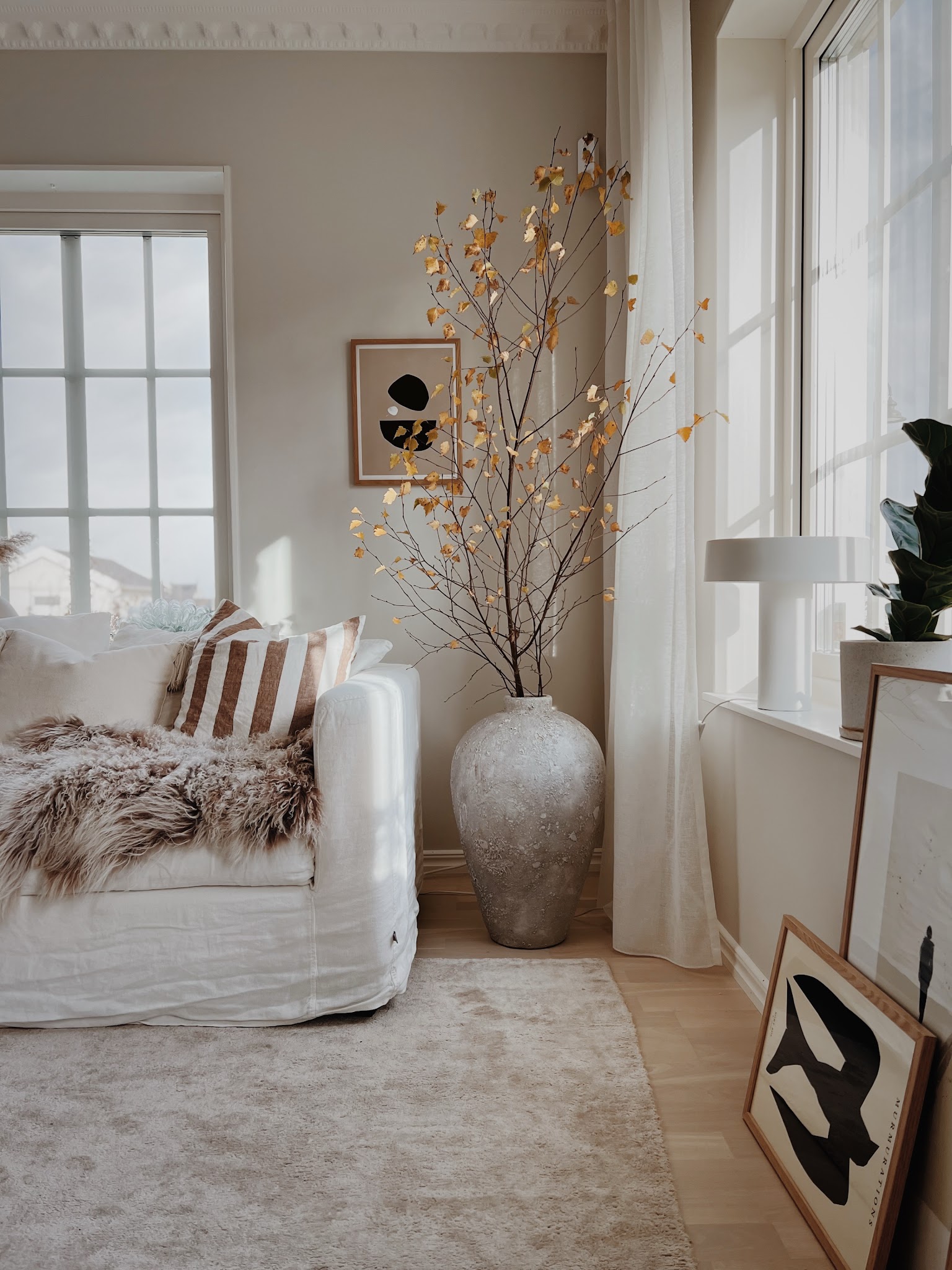 7. Bring Seasonal Branches Into a Sunny Corner