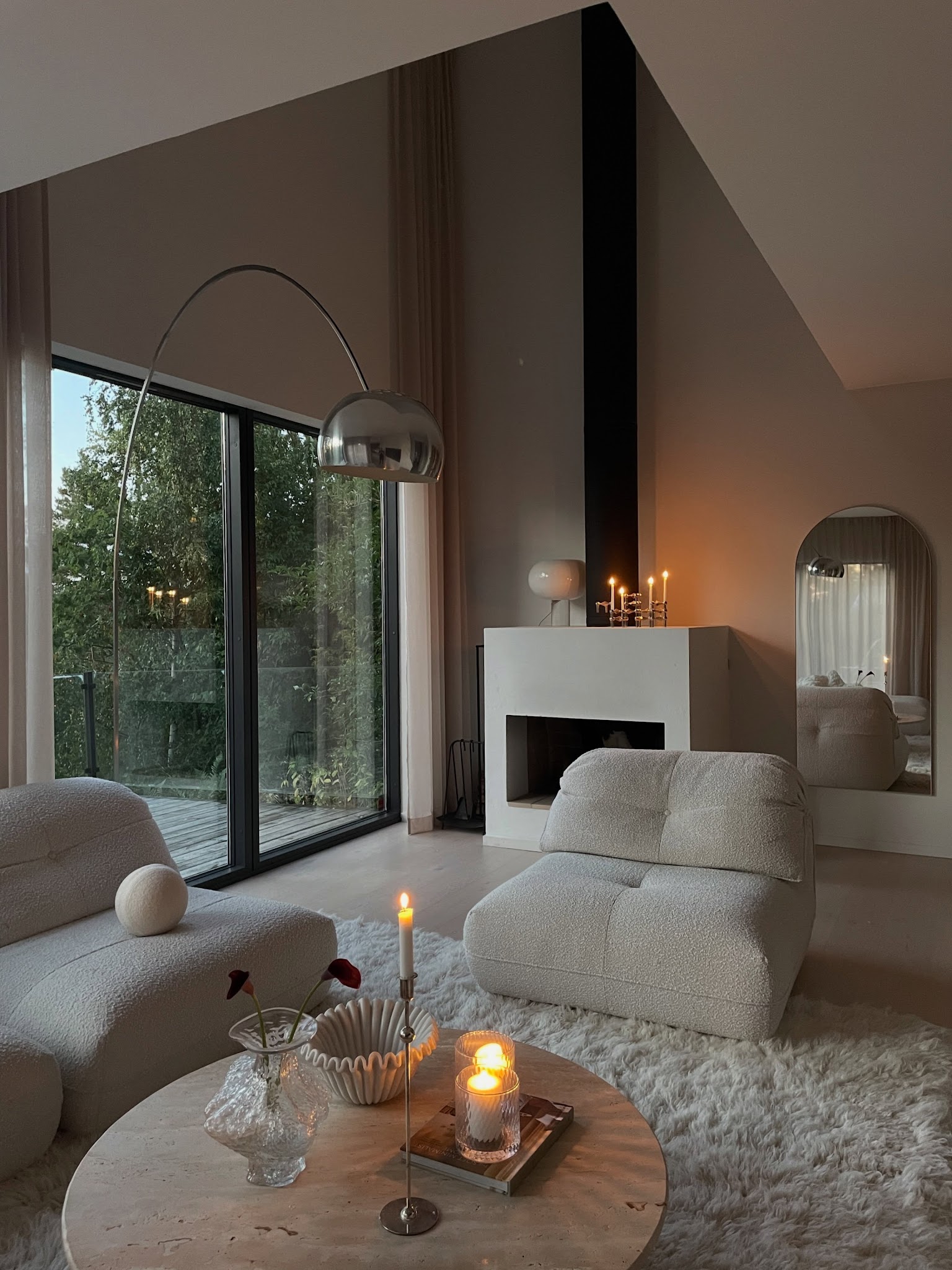 11. Use Low Lounge Chairs Beneath a Tall Ceiling