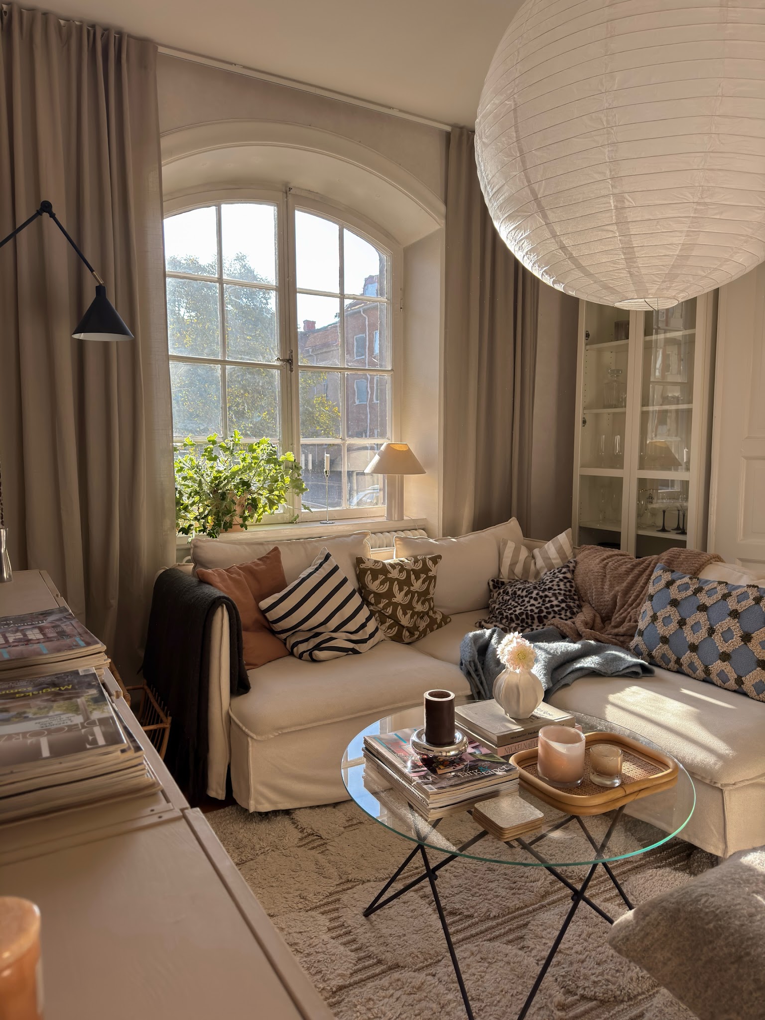 13. Combine a Paper Pendant With Collected Pillows