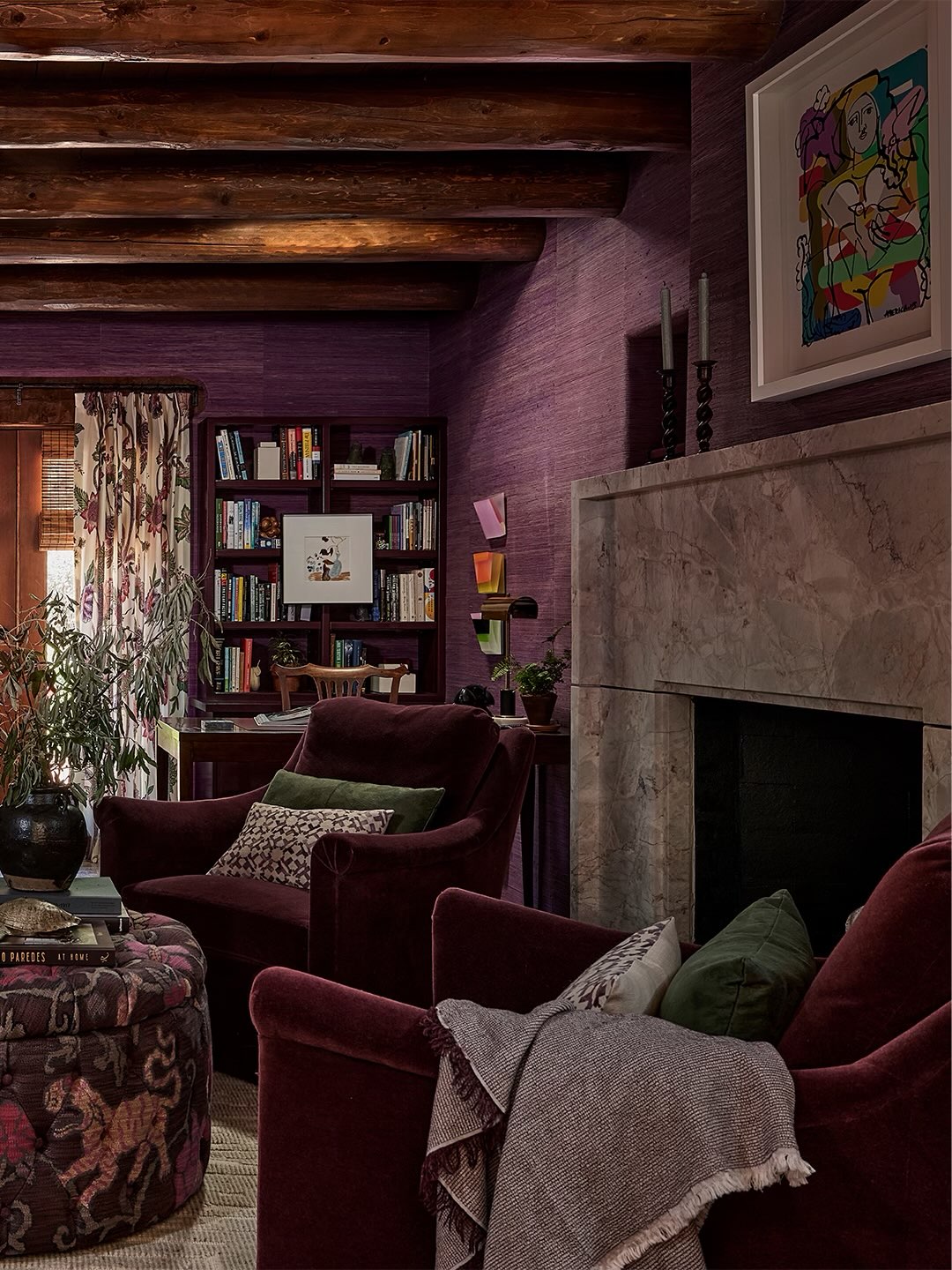 3. Let Plum Upholstery Deepen the Wood Tones