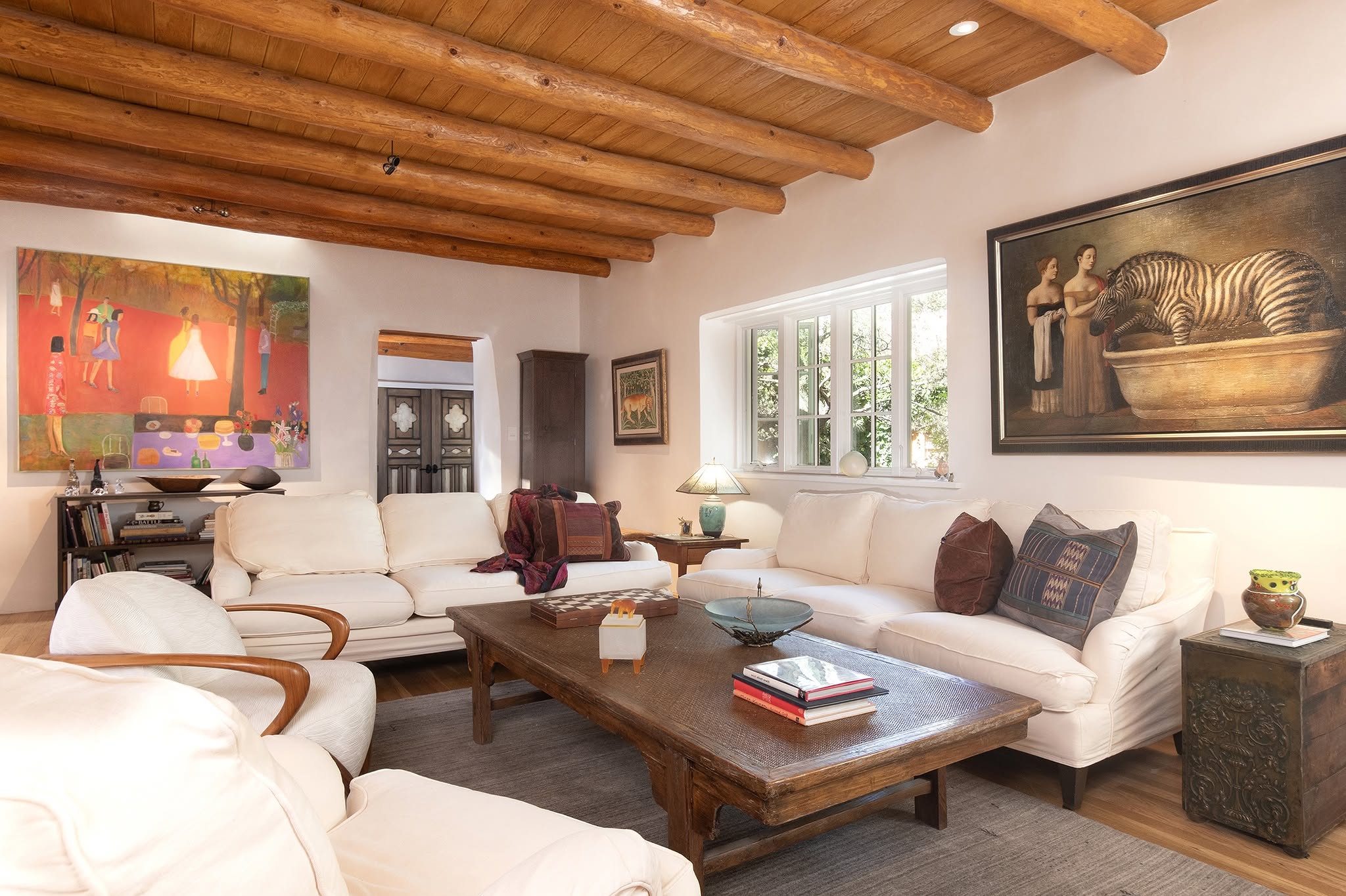 12. Let Bold Art Lead a White Adobe Room