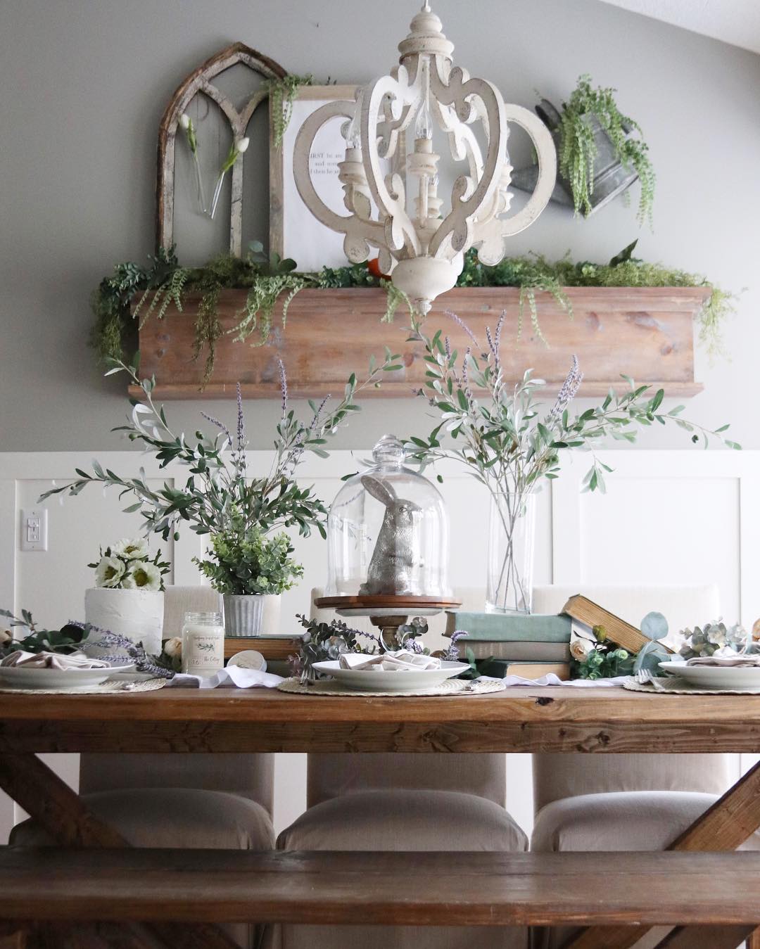 19. Frame a Glass Cloche With Airy Greenery and Books