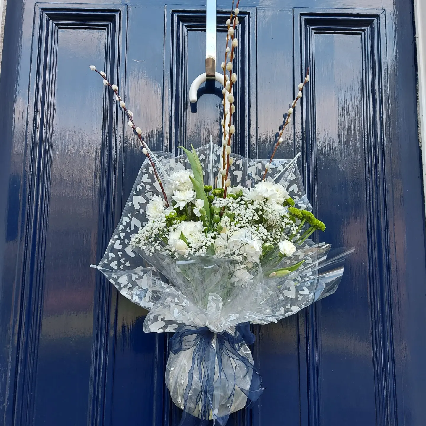 17. Display White Flowers in a Clear Umbrella