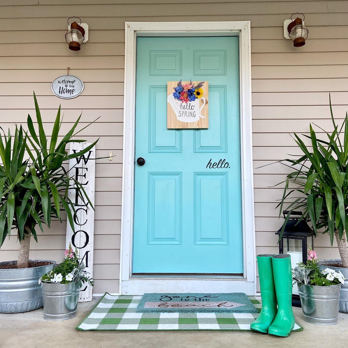 18. Center a Watering Can Sign on a Colorful Porch